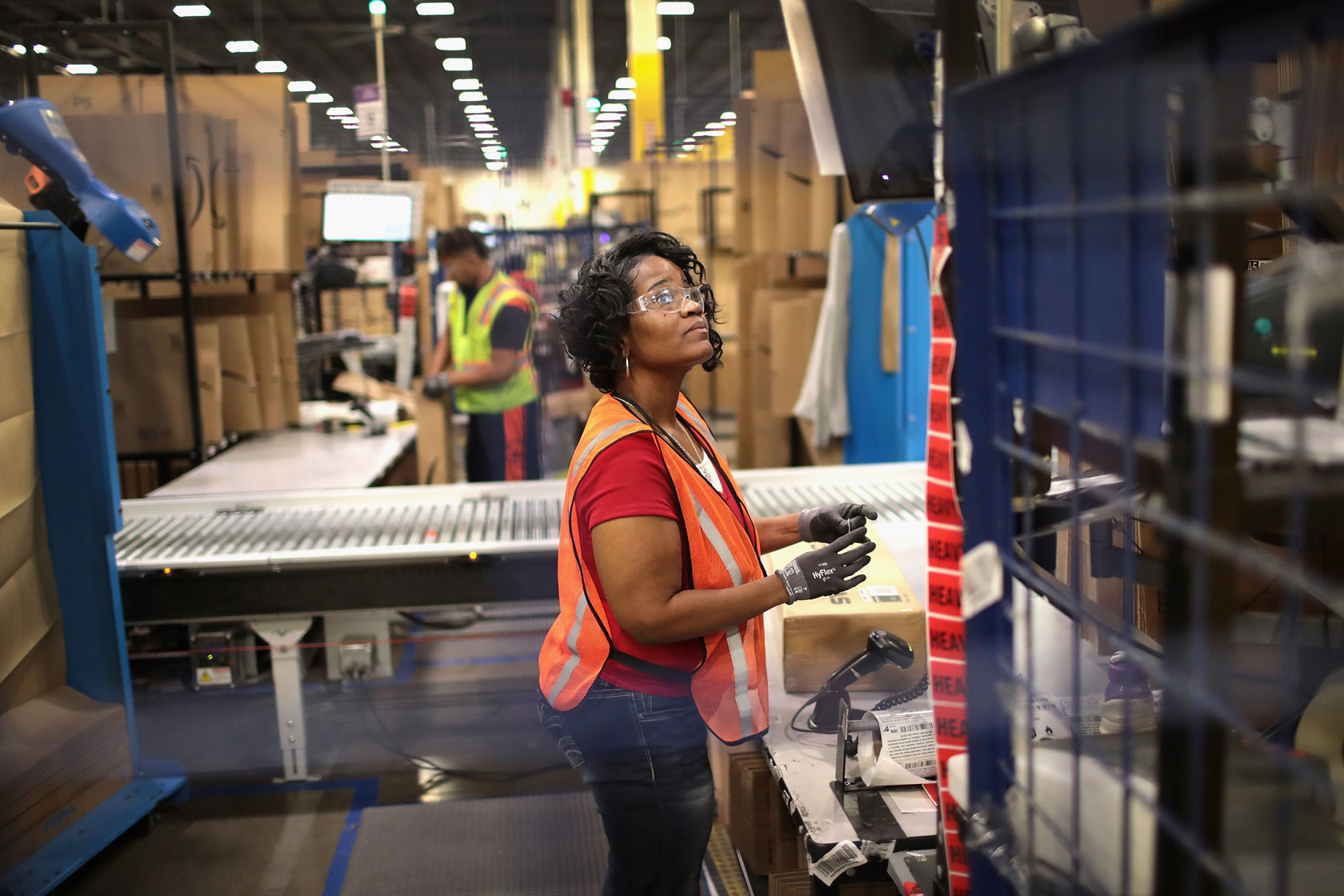 Workers pack and ship customer orders.