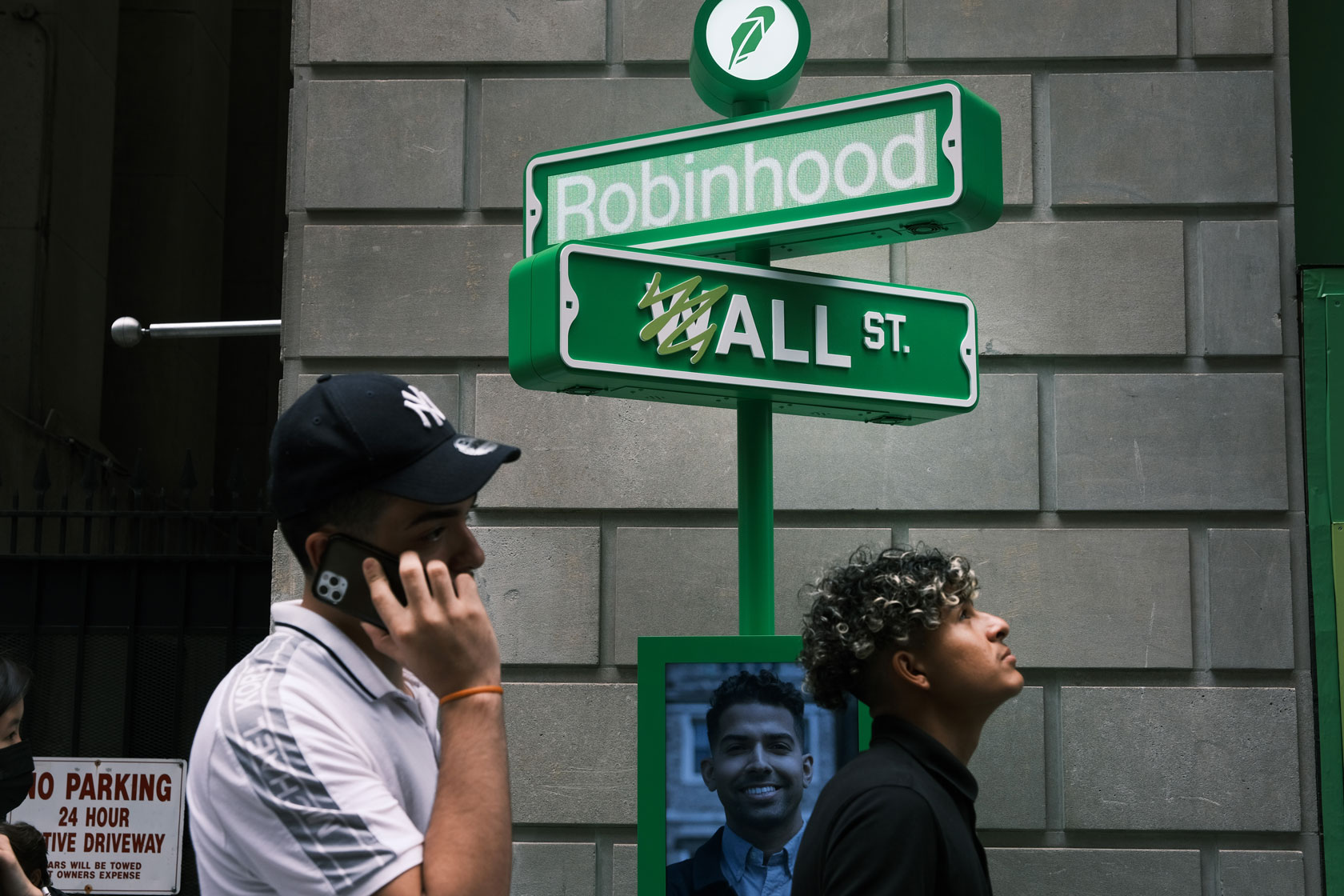 People wait in line at a pop-up kiosk along Wall Street.