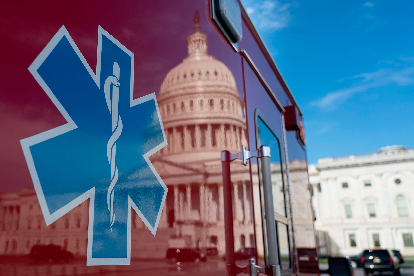 A reflection of the U.S. Capitol is seen on an ambulance.