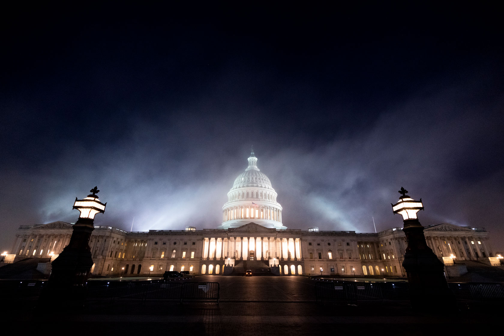 Fog surrounds the U.S. Capitol dome.