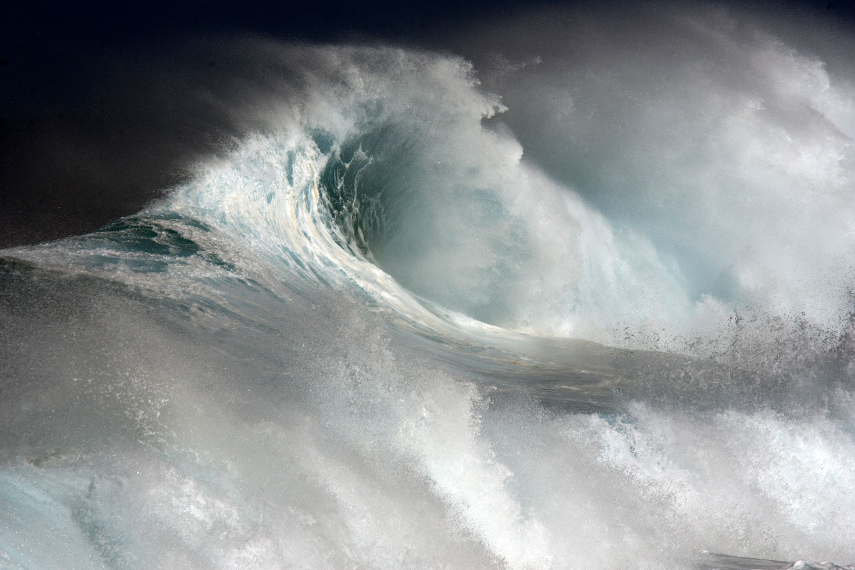 A wave crashes during a heavy swell in the Pacific.