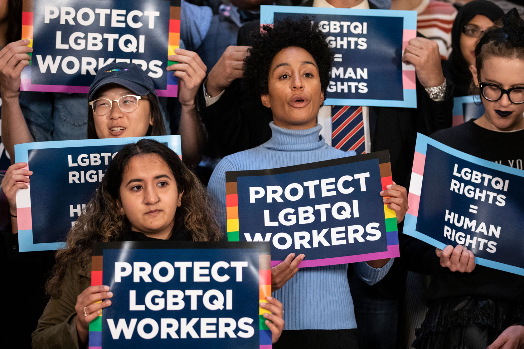 Activists holding signs that read 