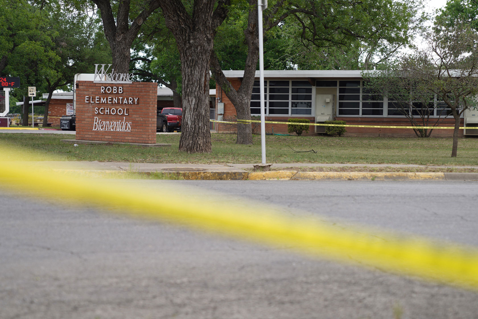 Sheriff crime scene tape is seen outside of Robb Elementary School.