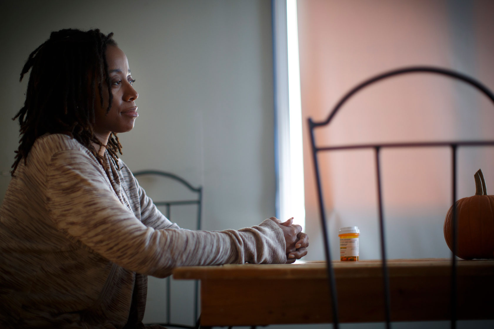 A woman with sickle cell disease poses for a portrait.