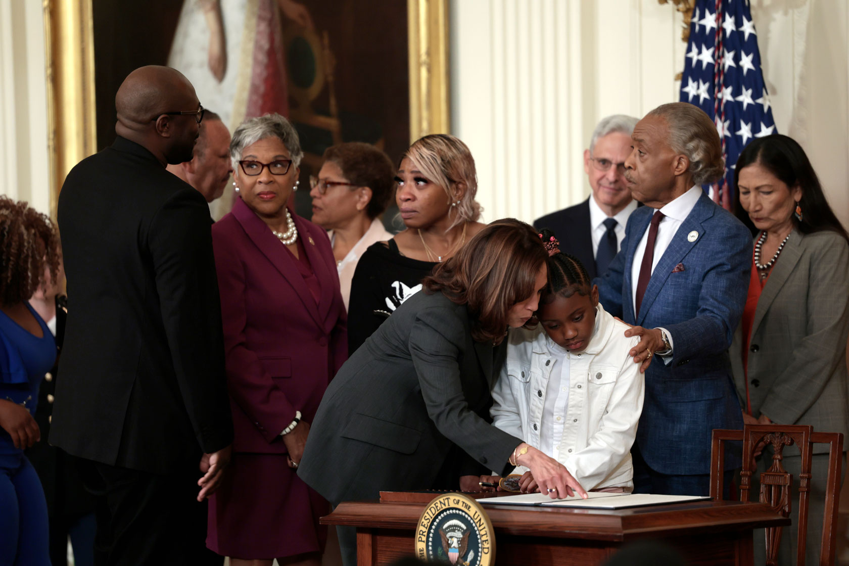 Vice President Kamala Harris speaks to Gianna Floyd, the daughter of George Floyd, after an executive order signing event enacting further police reform.