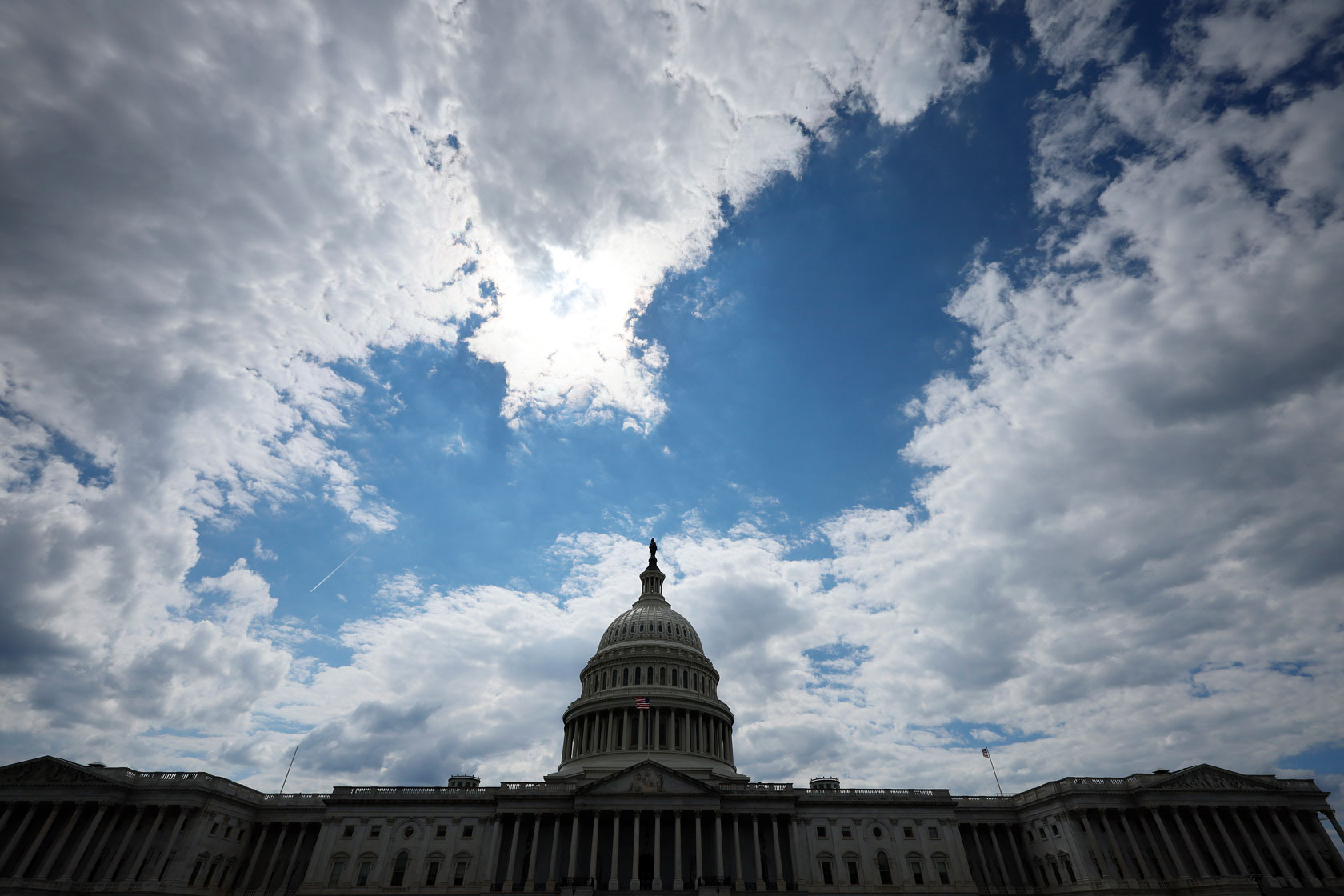 The U.S. Capitol building is seen in Washington against a partl cloudy sky.