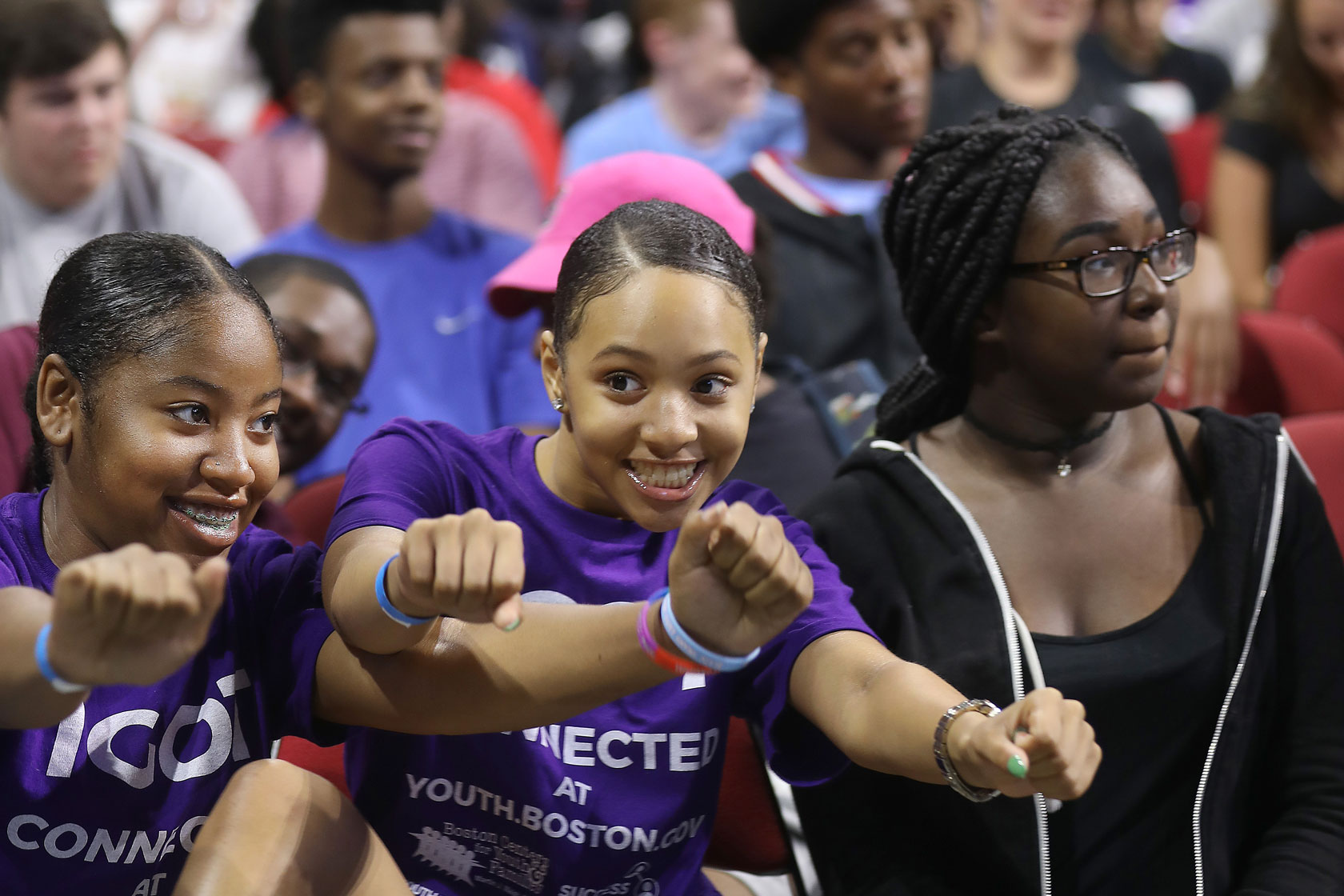 Three high school students participate in an event for for Boston’s SuccessLink summer youth jobs program.