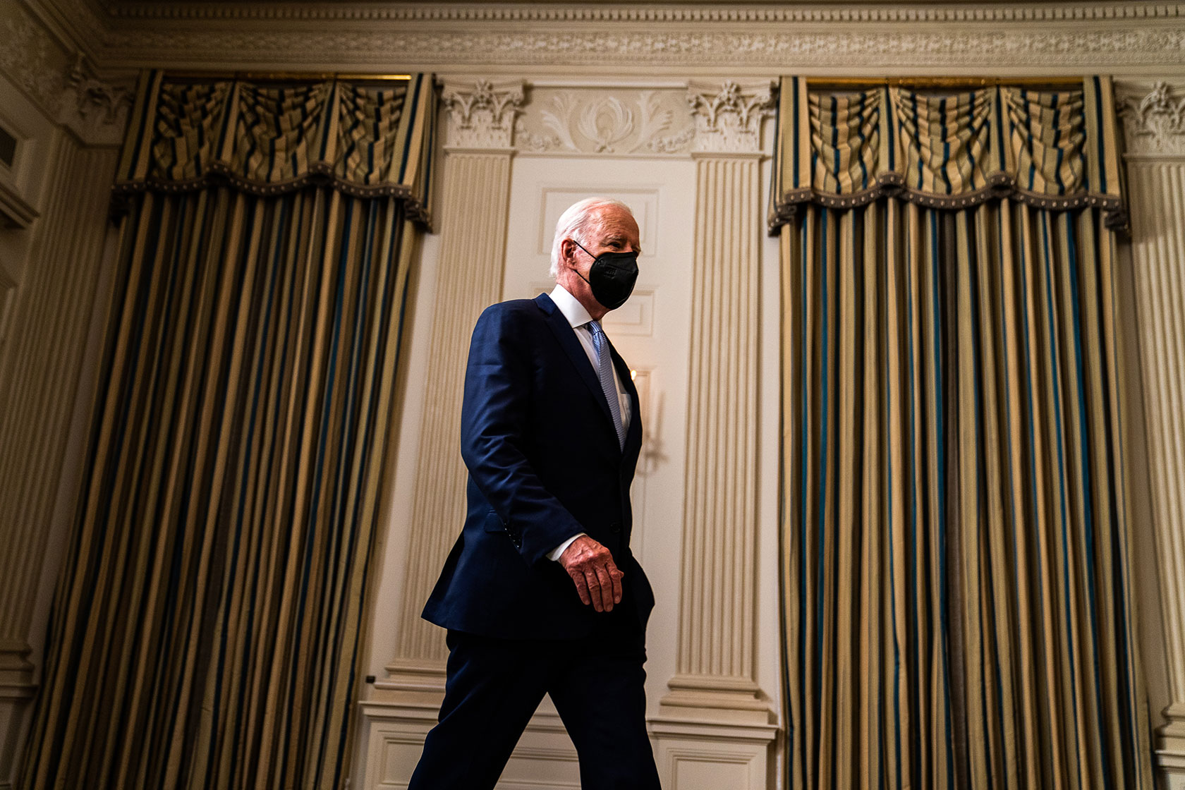 President Joe Biden enters the room to deliver remarks on the Inflation Reduction Act.