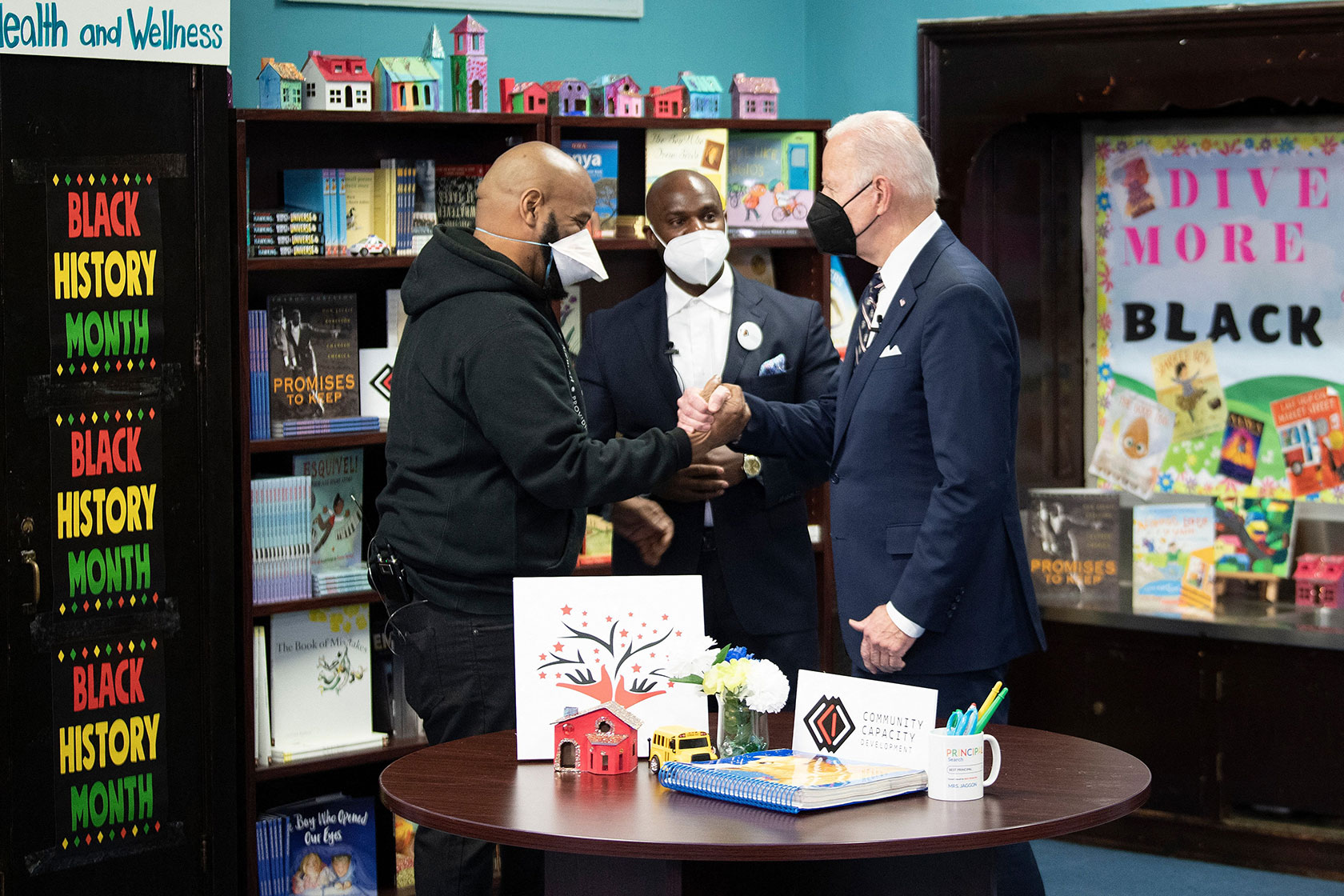 U.S. President Joe Biden greets Shyism Bryant, a violence interruption training specialist.