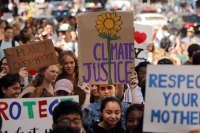 A group of protesters march through the streets of New York City to demand action on the global climate crisis.
