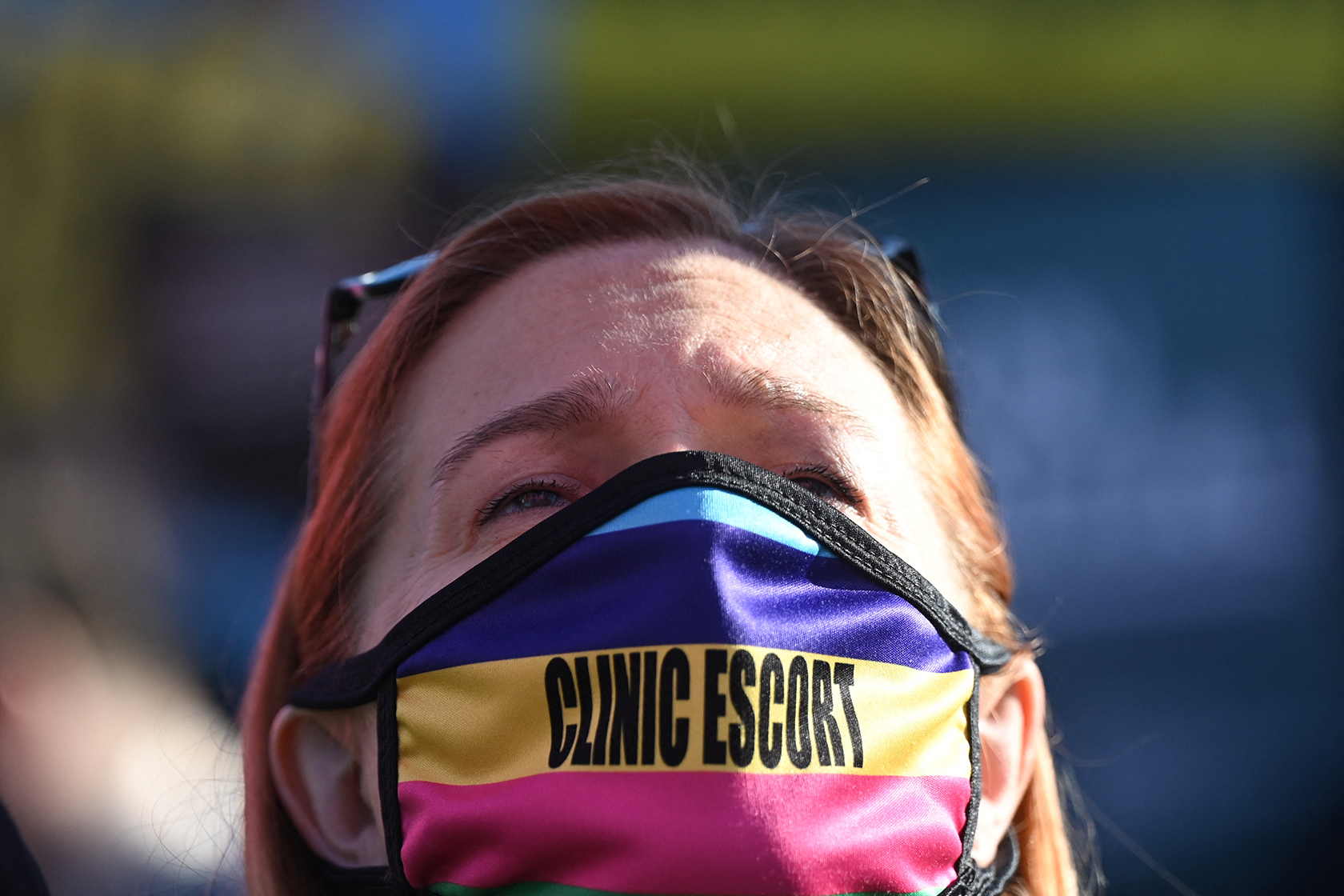 Woman wearing face mask that says