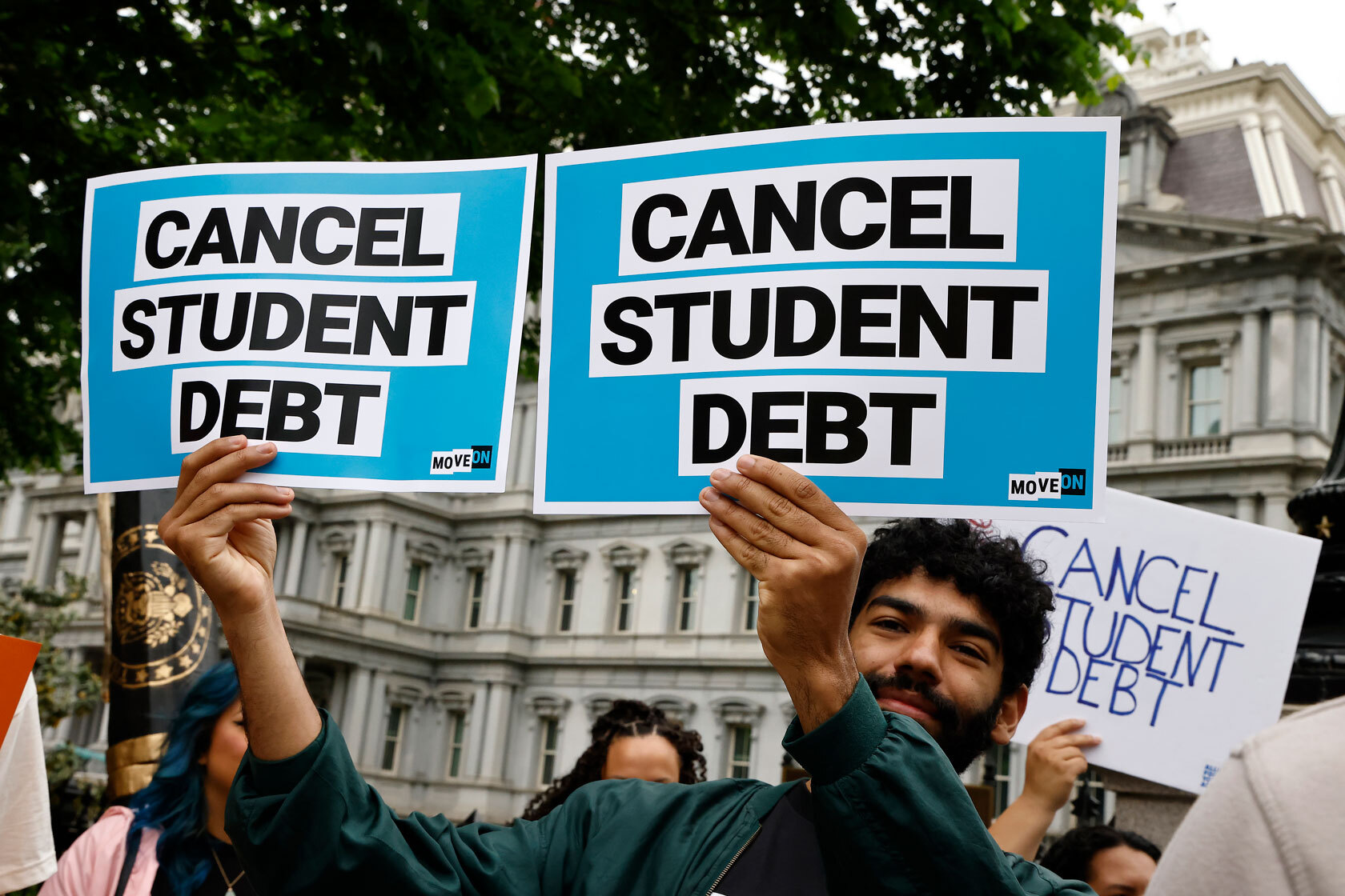 Student loan borrowers gather near the White House to urge President Joe Biden to cancel student debt