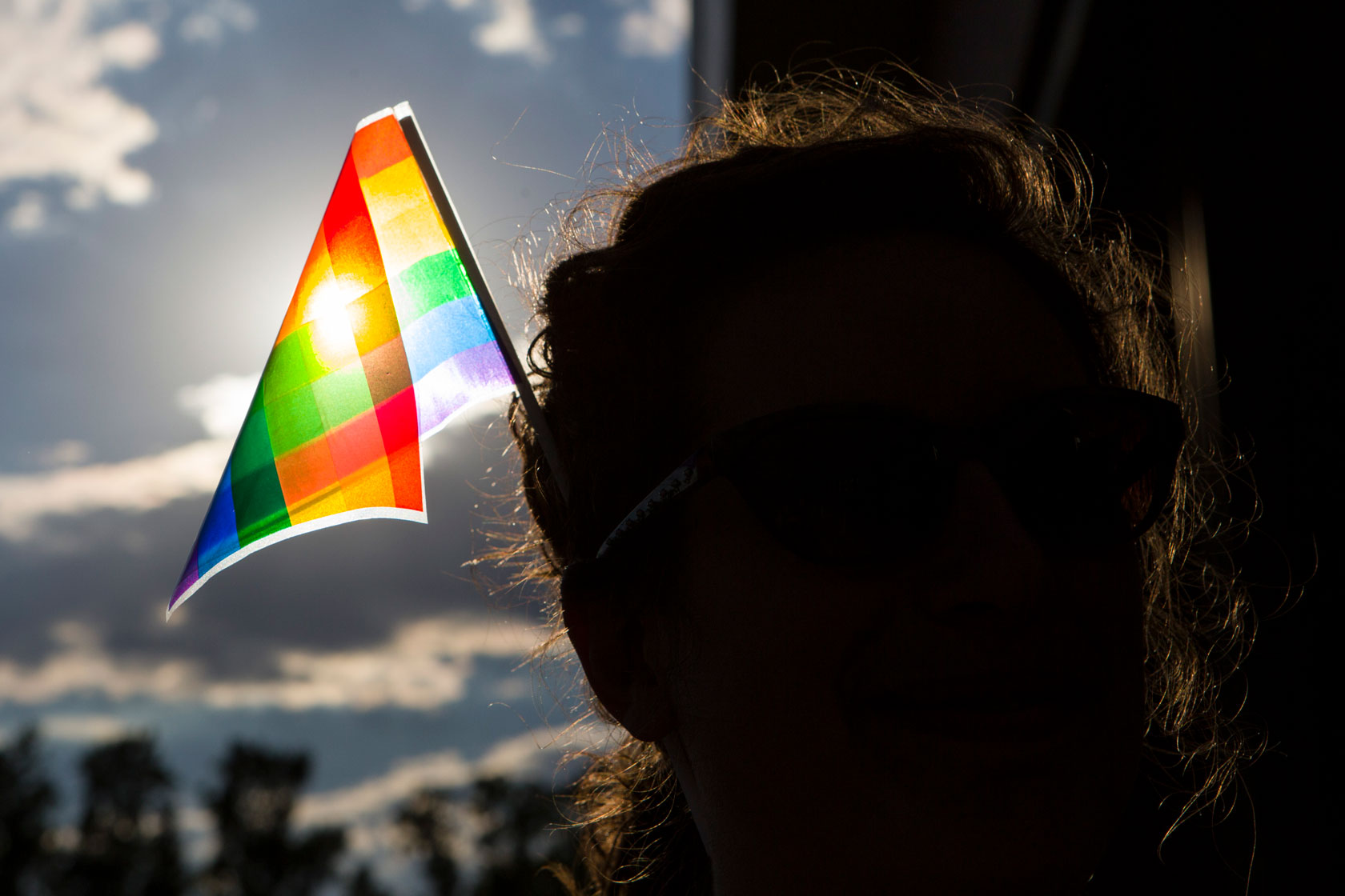 A woman wears a pride flag in her hair in Manassas, Virginia.