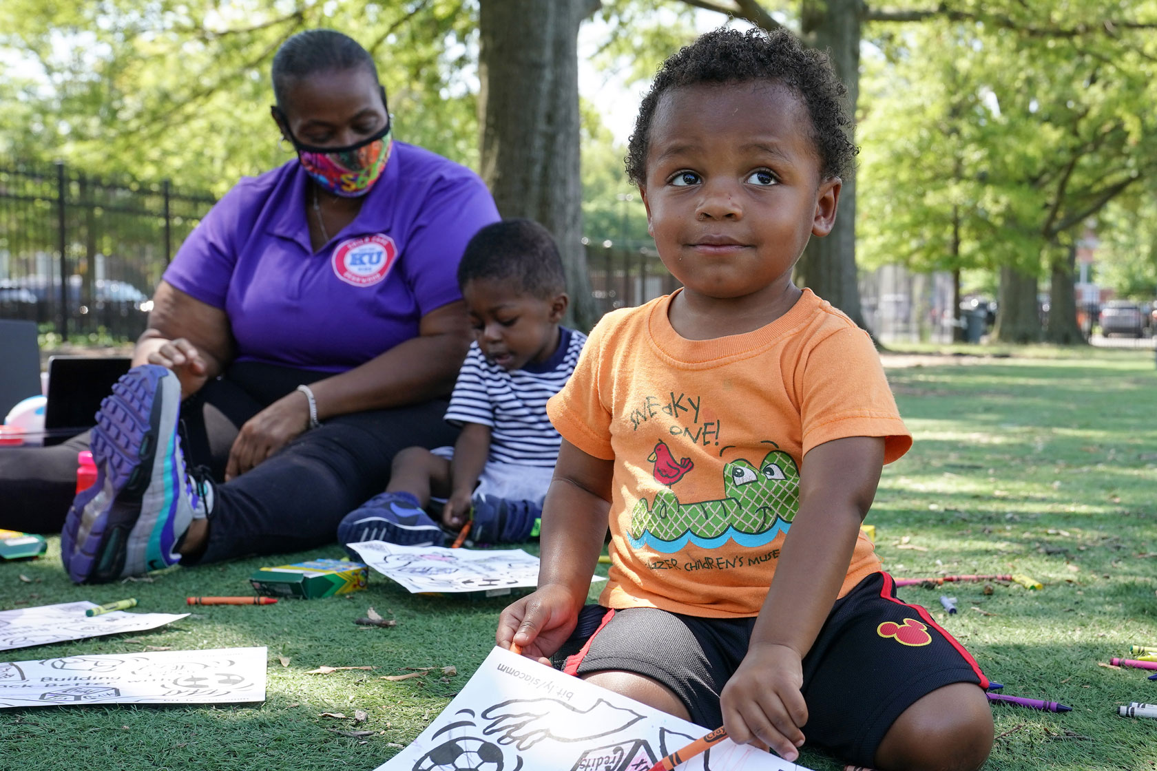 Children complete activities at an event celebrating the launch of the child tax credit.