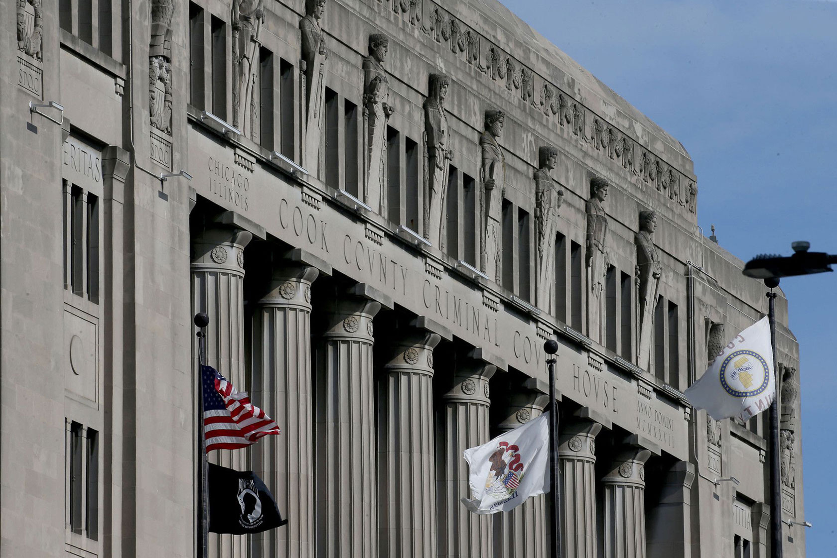 The Cook County Criminal Court House is viewed beneath a blue sky on July 7, 2021.