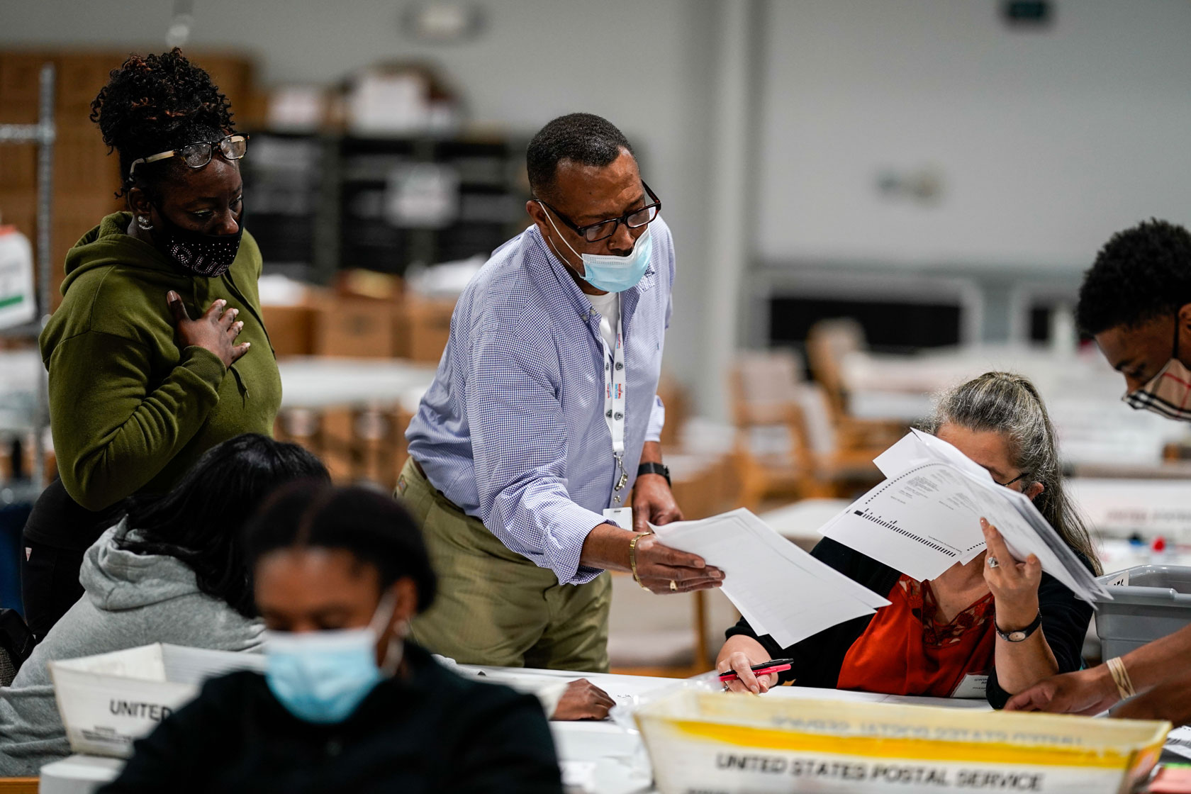 Election workers validate ballots in Georgia.