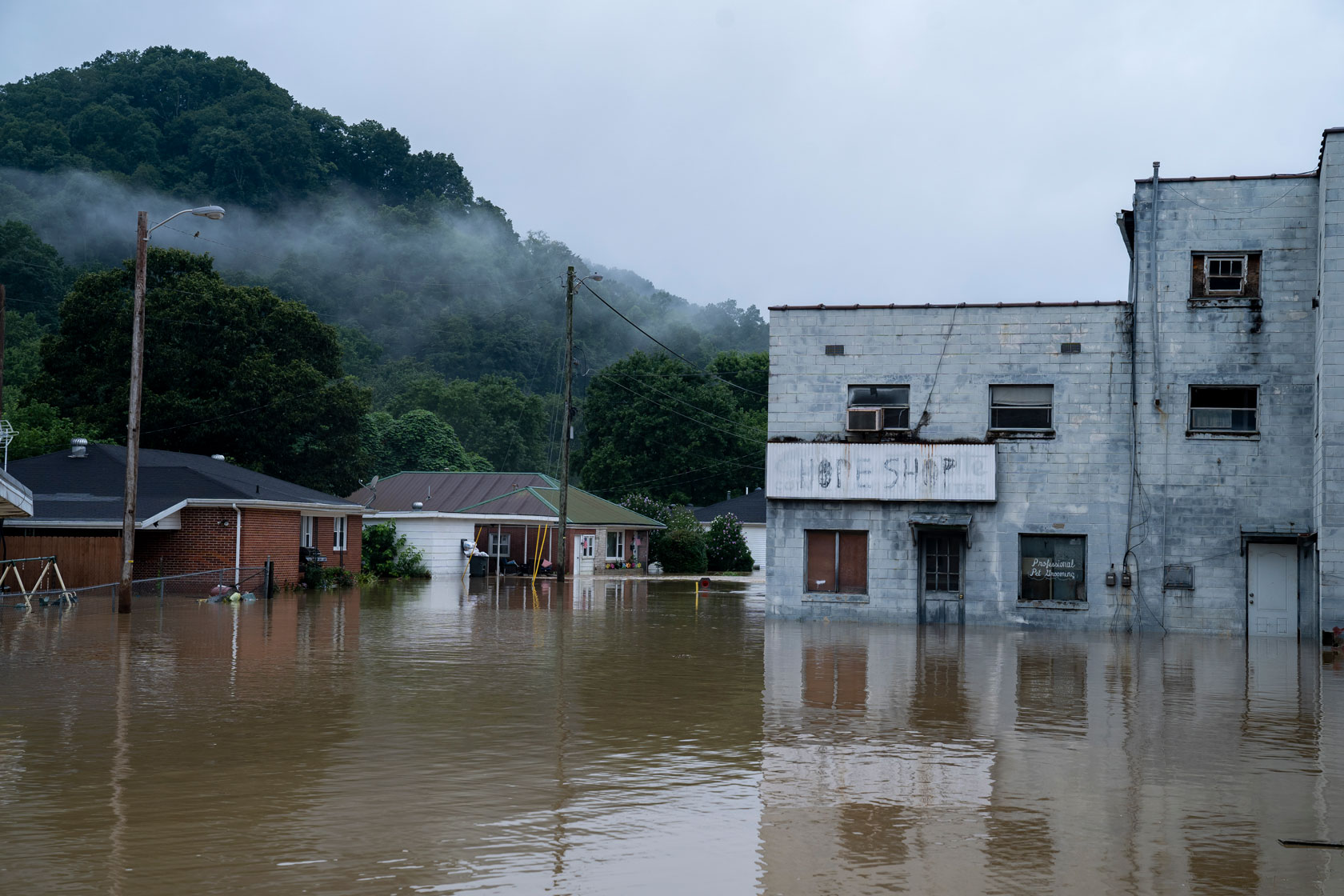 Photo shows a flooded street in Kentucky.