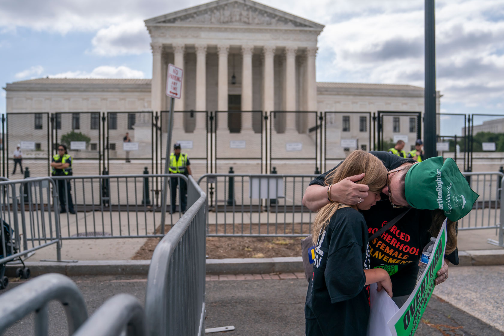 An abortion rights activist comforts her daughter following the 6-3 Supreme Court ruling in Dobbs v. Jackson Women's Health Organization.