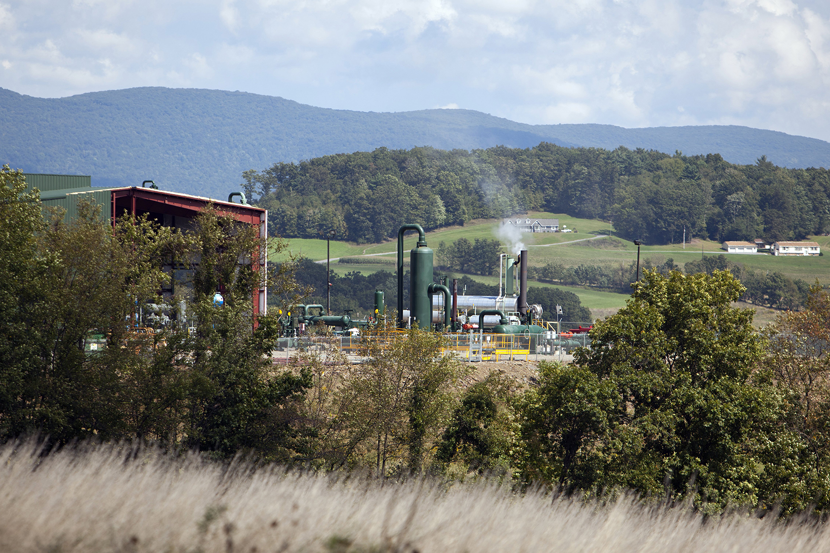 View of natural gas compressor; mountains in distance