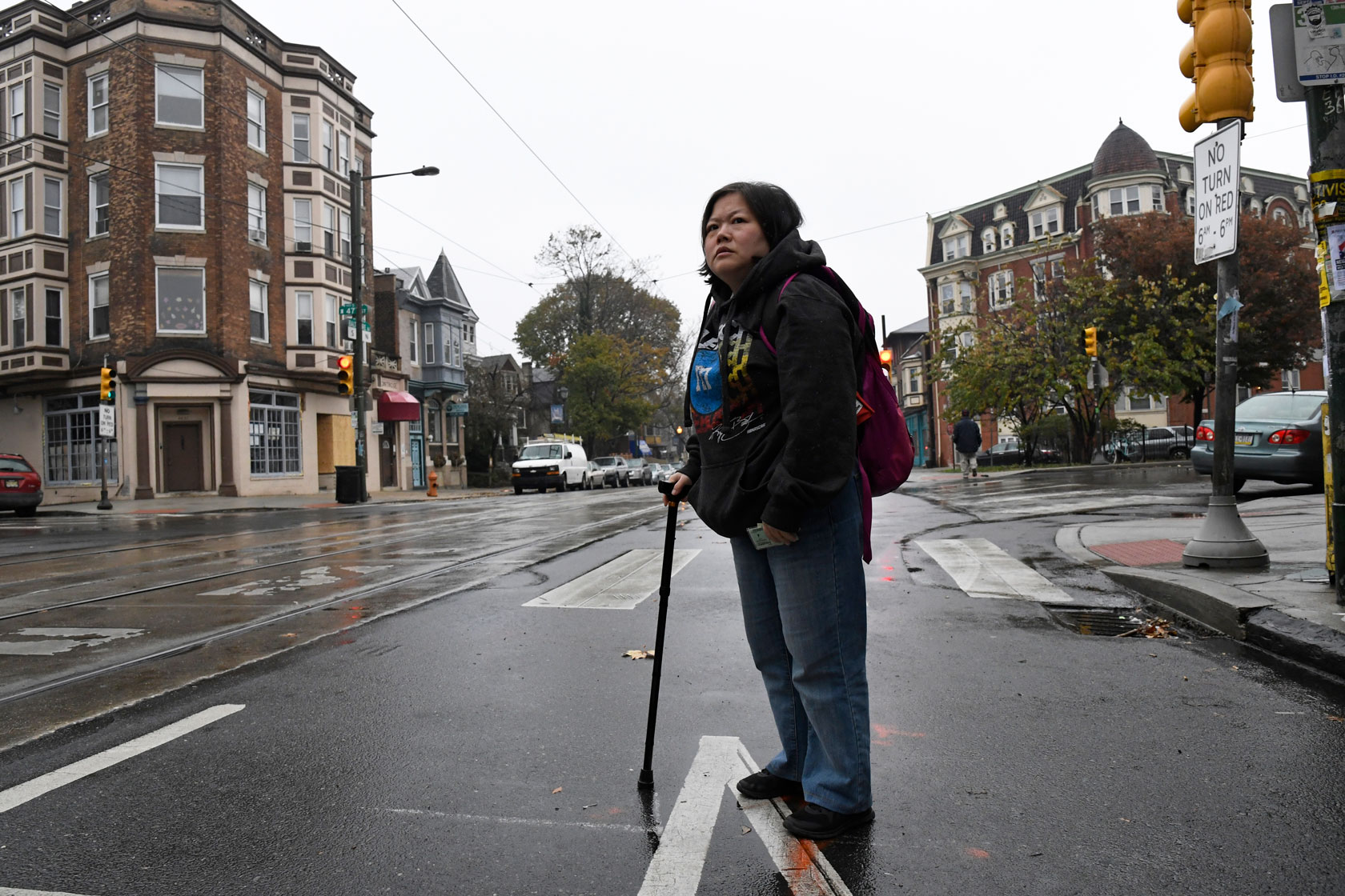 Min Jung waits for a trolley to go to her physical therapy appointment.