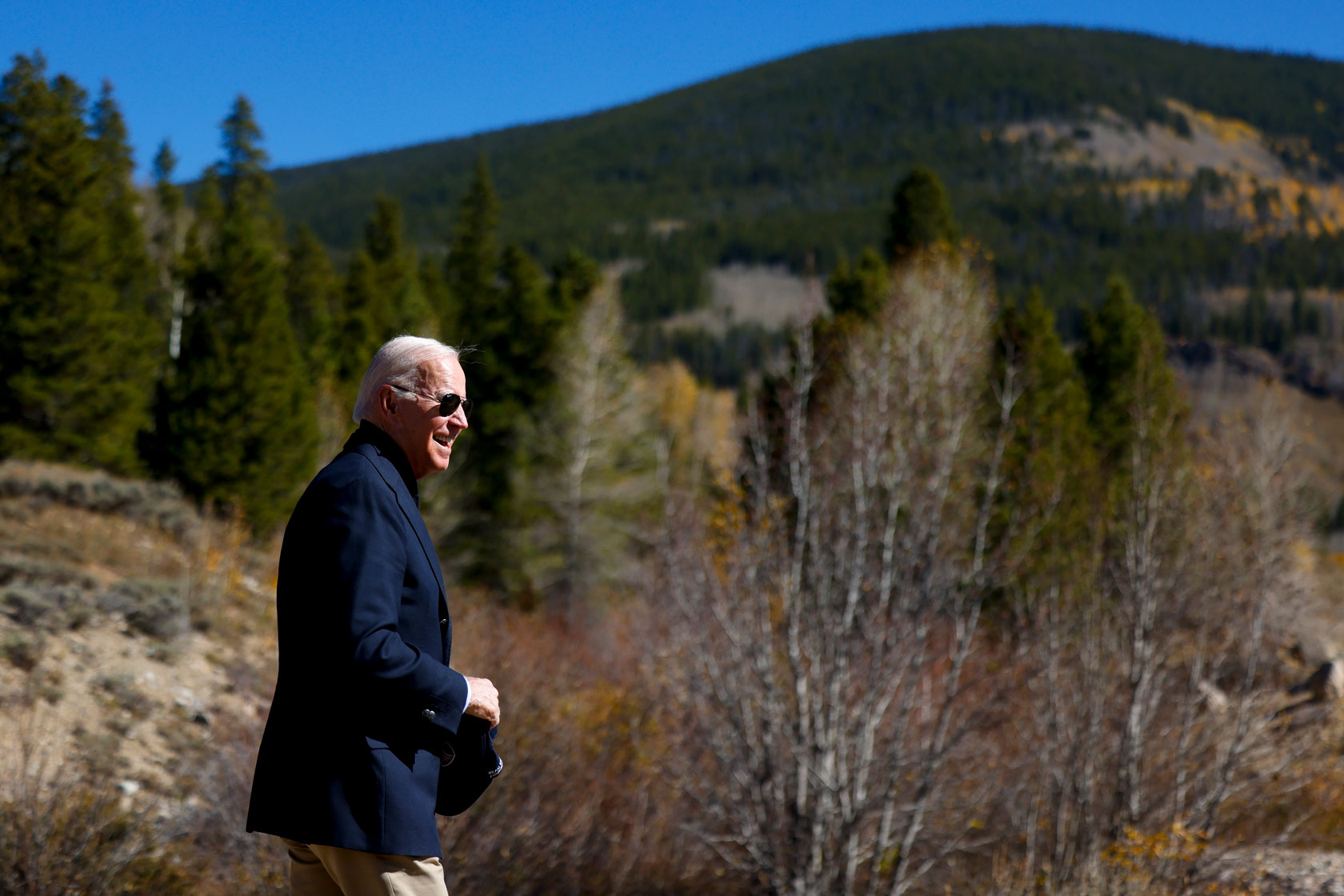 U.S. President Joe Biden walks through Camp Hale before designating the area as a national monument.