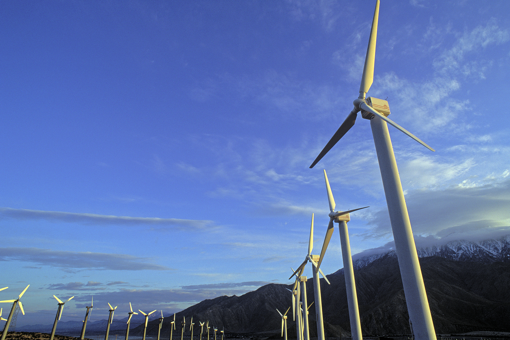 Wind turbines against blue sky