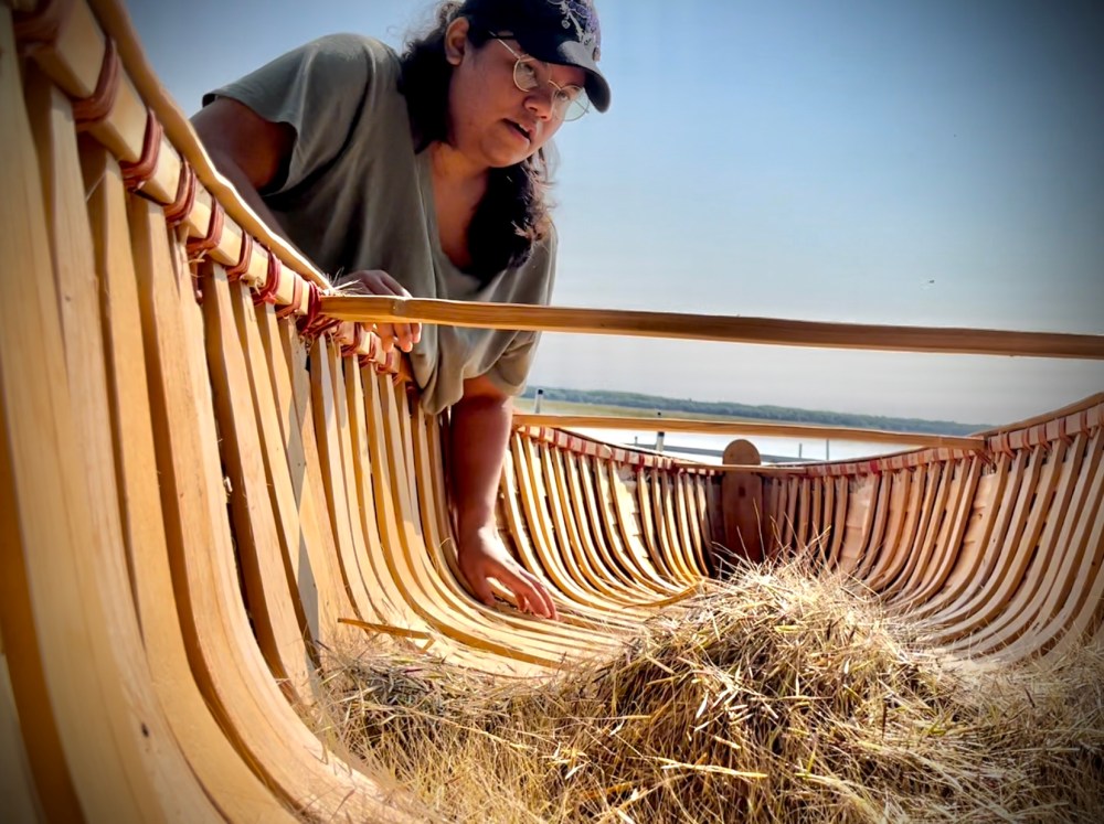 LLTC student Kendra Haugen cleans wild rice.