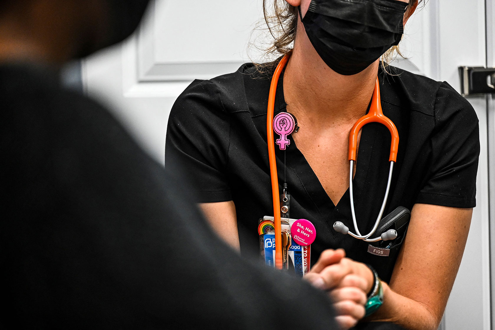 A woman has her vitals checked at a family planning center.