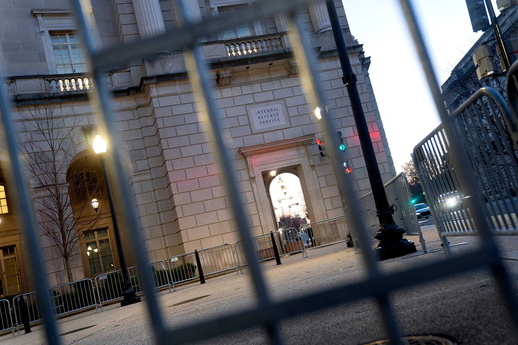 The IRS building is seen through a fence.