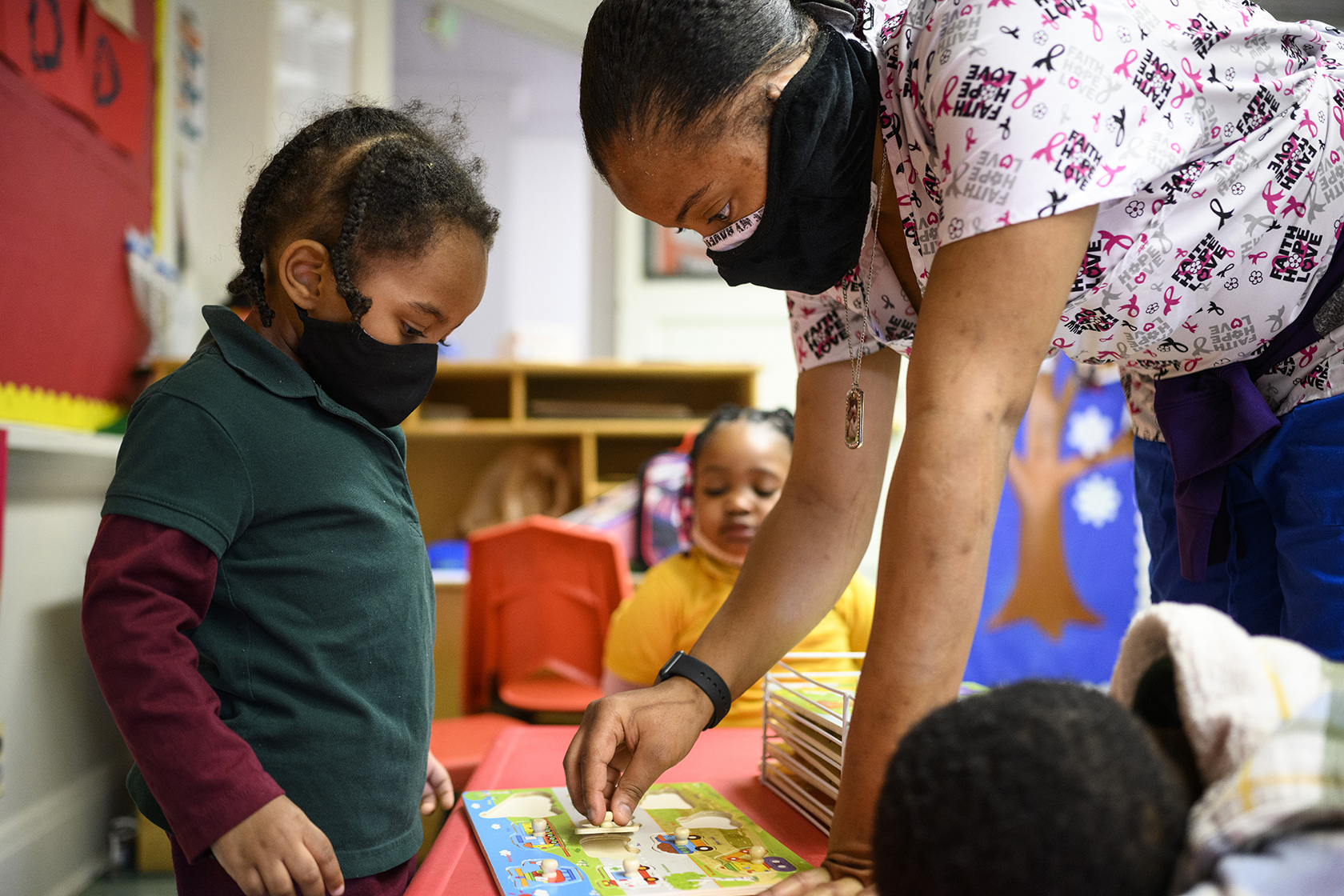 Child with early childhood teacher