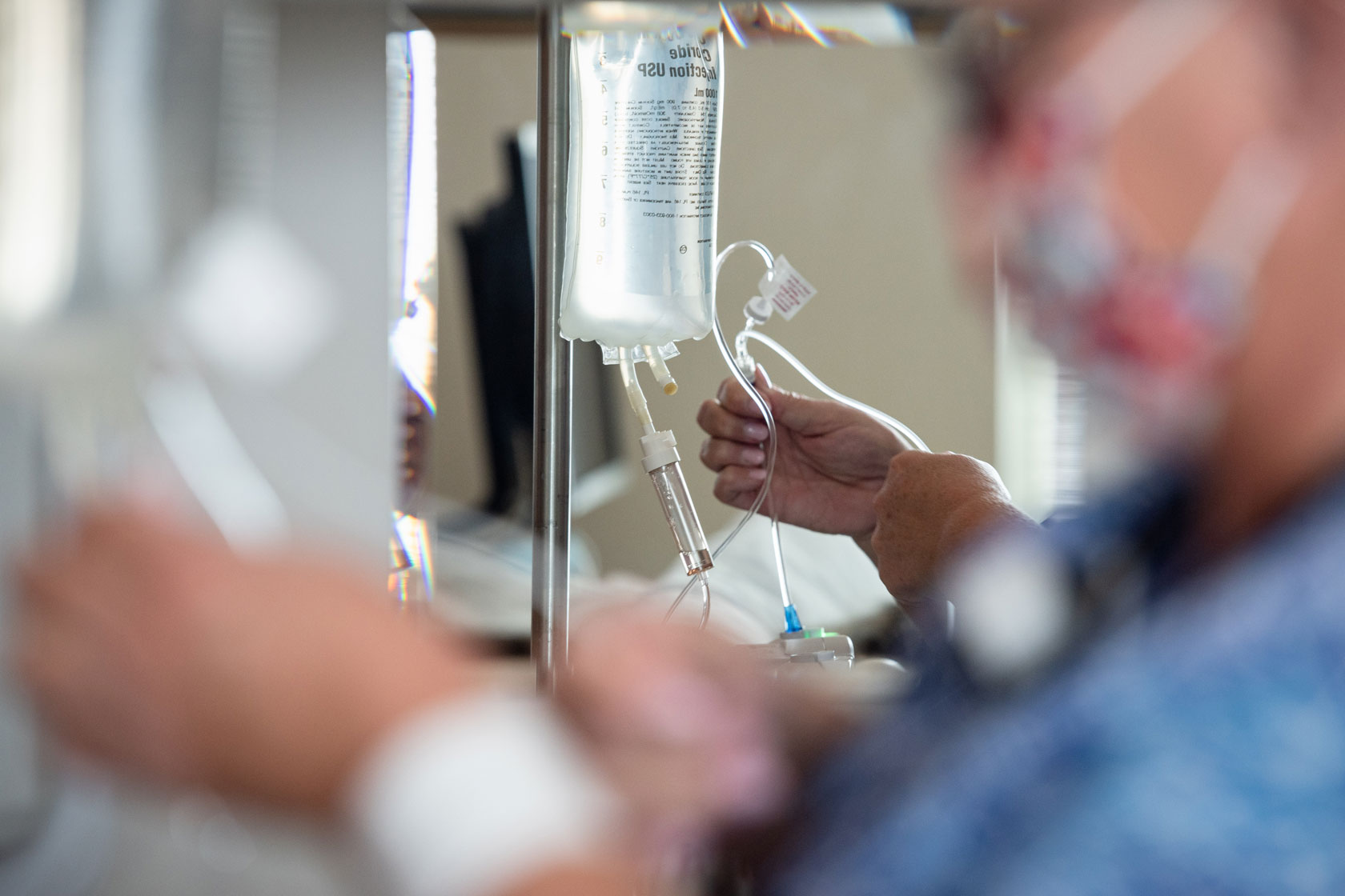 A nurse administers antibiotics to a patient