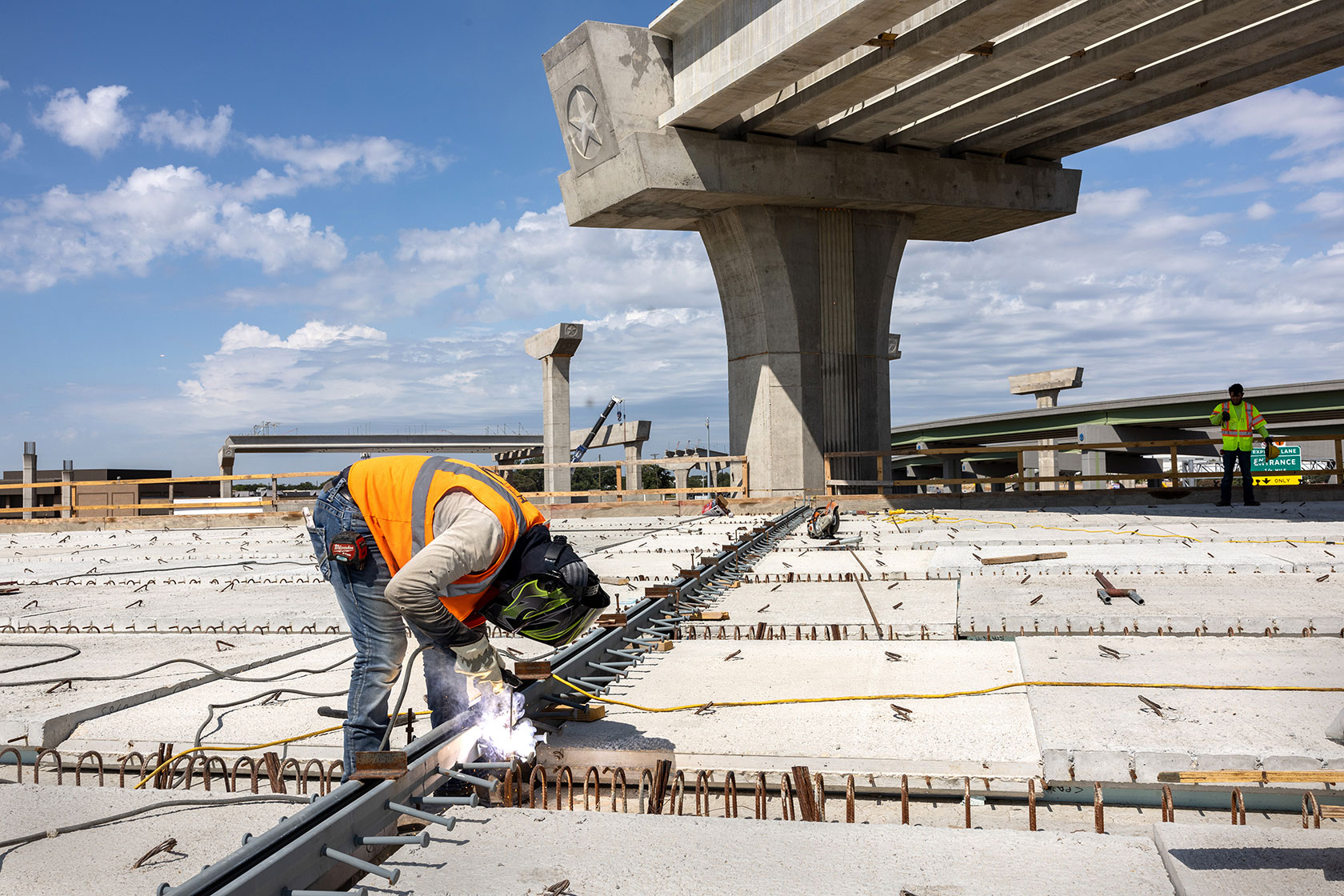 A welder works on an overpass in Irving, Texas.