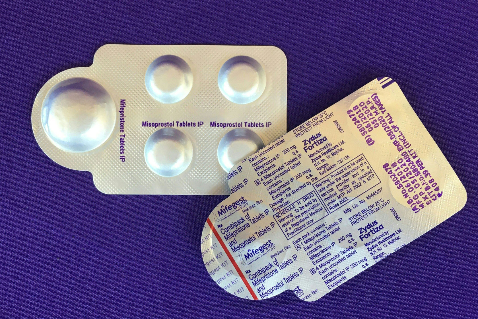 Unopened foil packets for two types of pills, which can be taken together for a medication abortion.