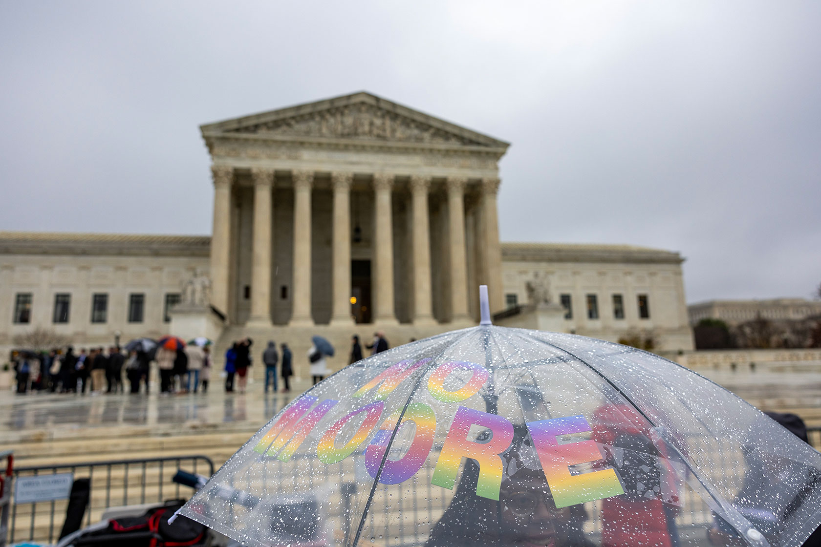 Demonstrators protest during a rally at the U.S. Supreme Court during oral arguments in Moore v. Harper.