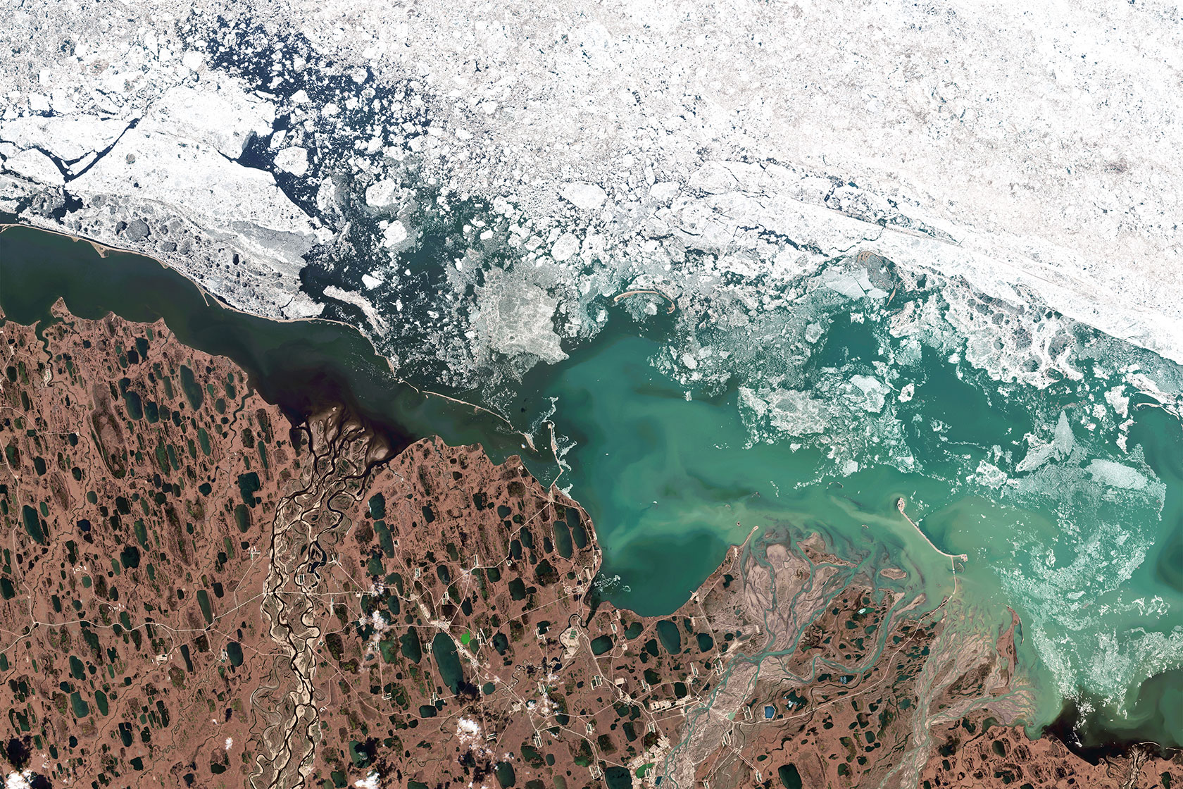 An aerial shot captures oil fields on Alaska's North Slope.