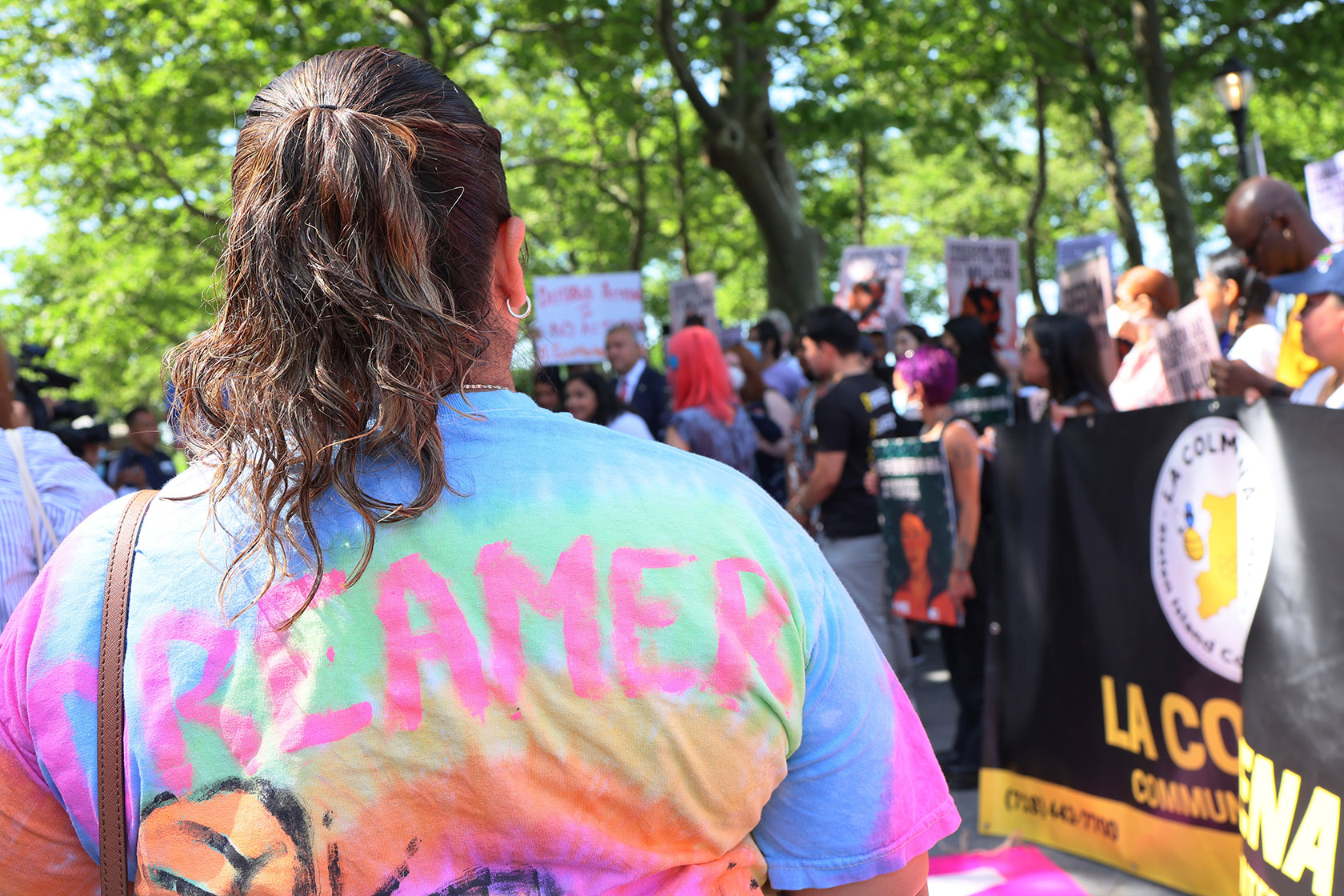 People gather for a rally to celebrate the 10th anniversary of DACA.