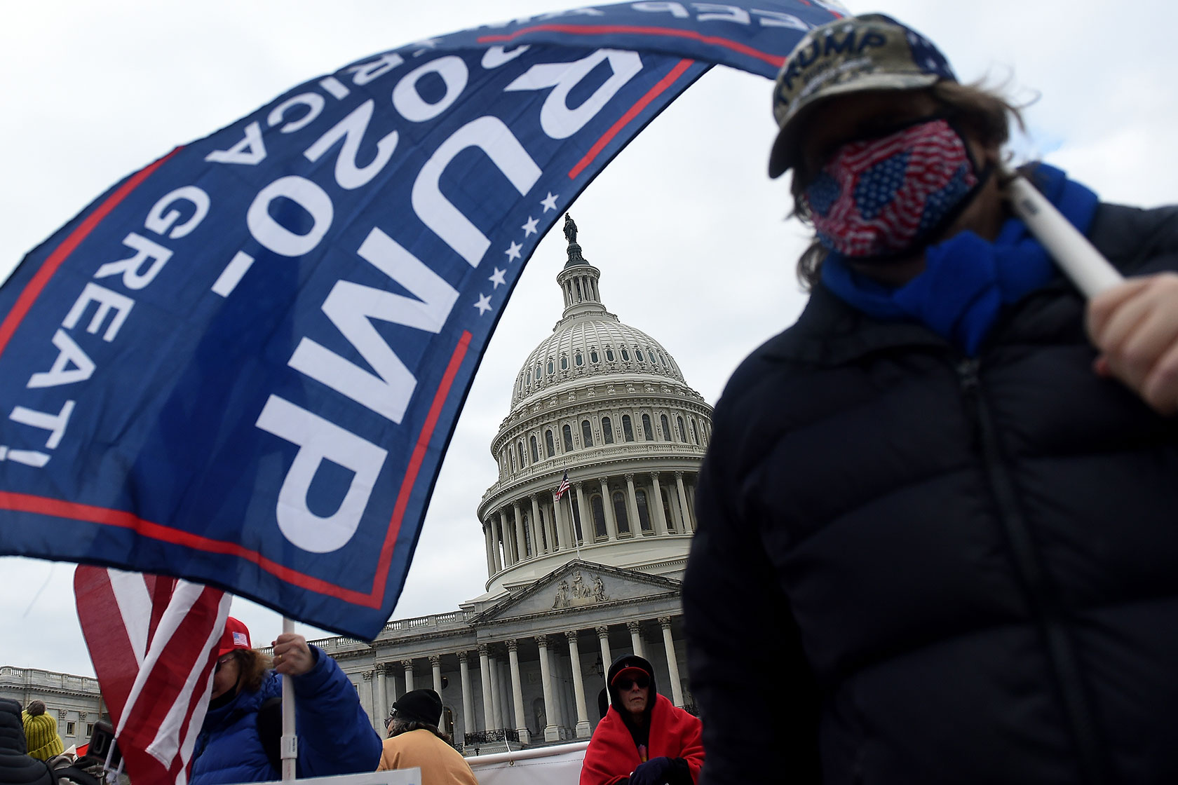 Supporters of then-President Donald Trump congregate outside the U.S. Capitol during the January 6 insurrection.