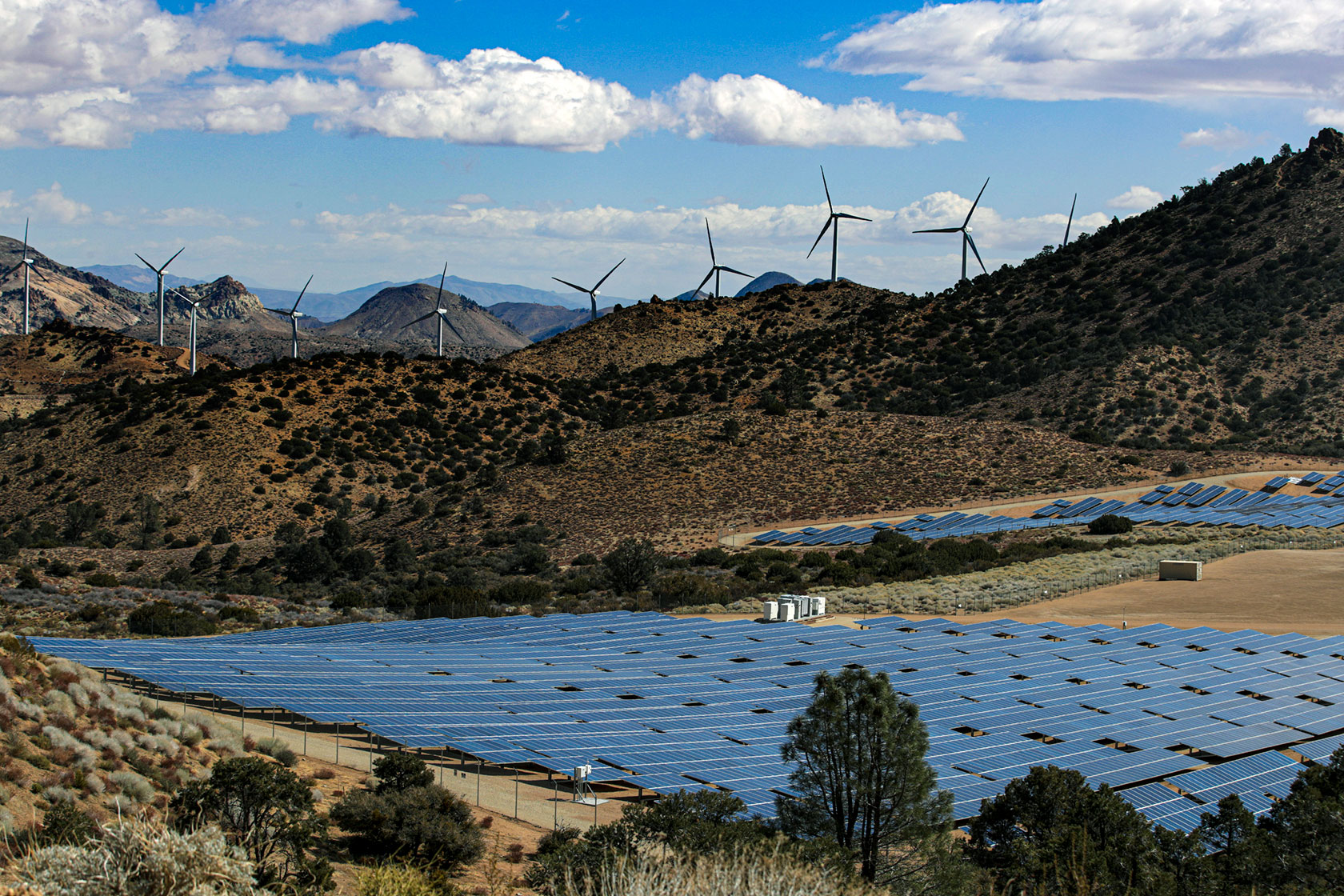 A wind and solar farm is seen nestled in California’s Tehachapi Mountains.
