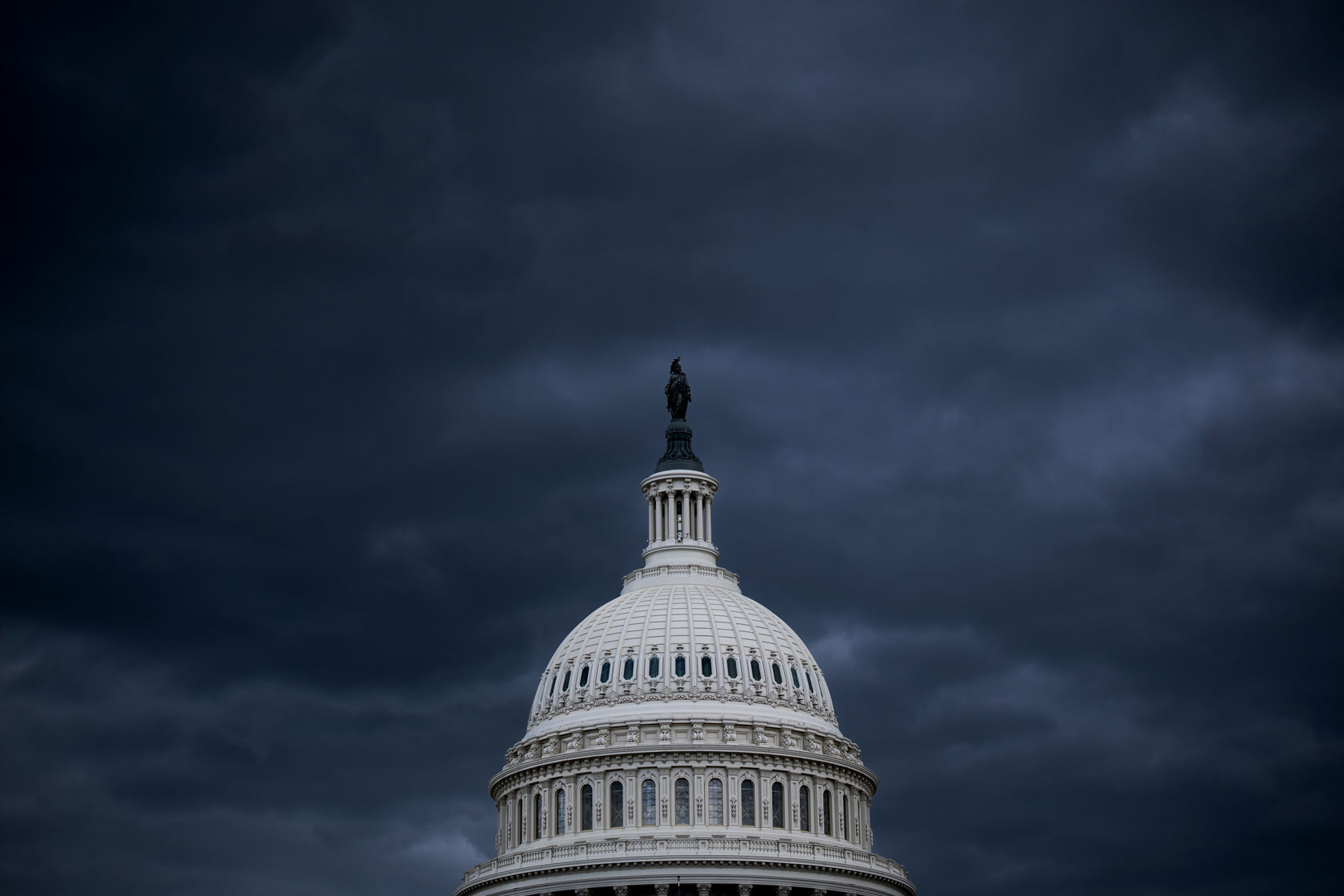 Image showing the U.S. Capitol dome against a dark sky.