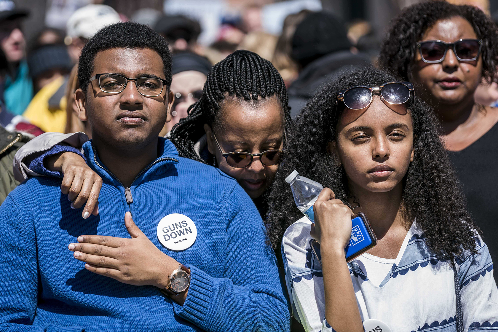 Three individuals at gun control rally