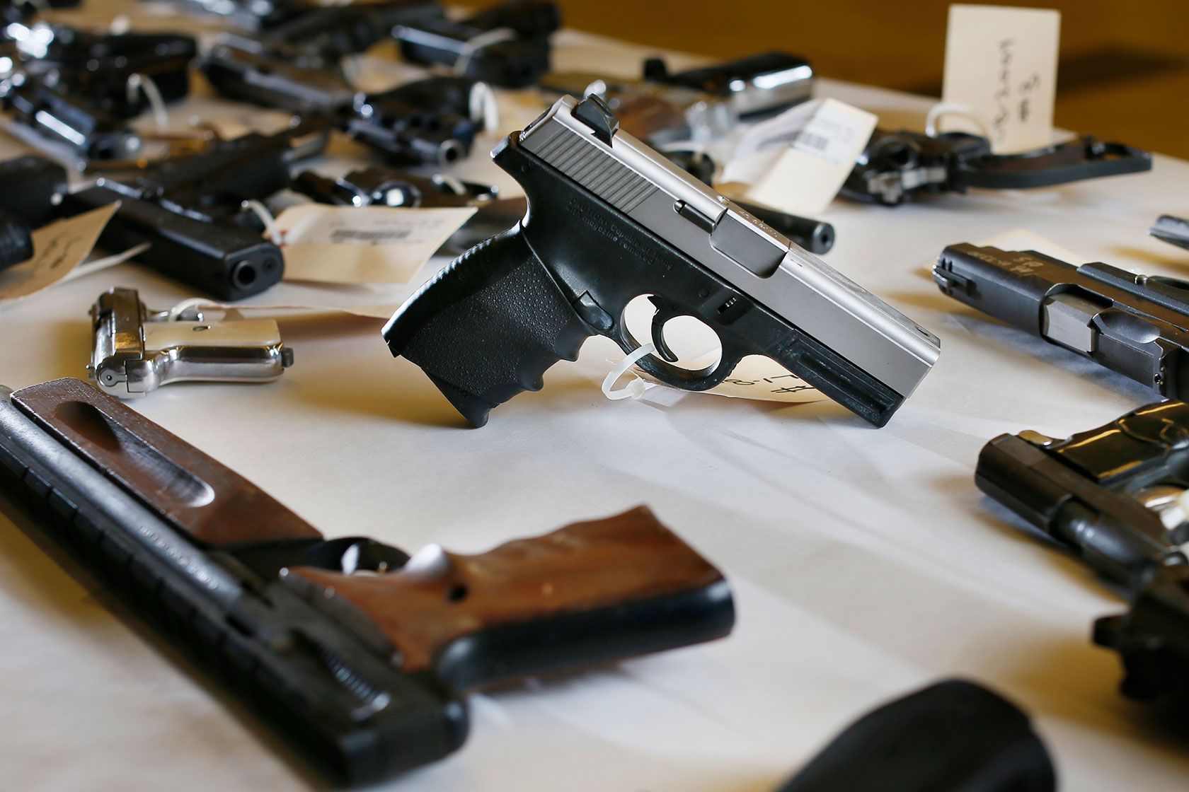 A collection of confiscated guns is stored in the Hennepin County Sheriff’s Office crime lab.