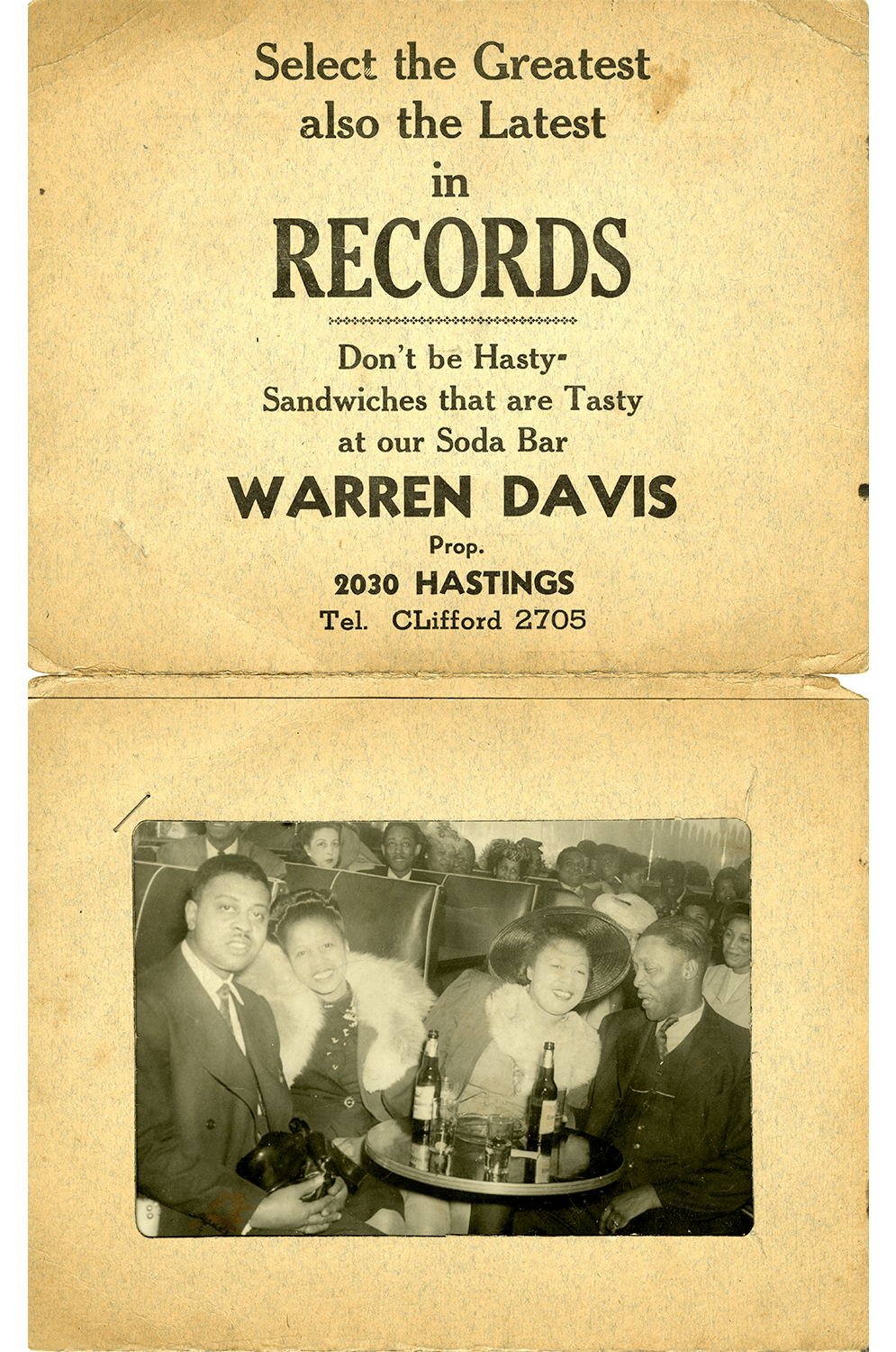 Souvenir photo card of four people in a Paradise Valley club in the 1940s.