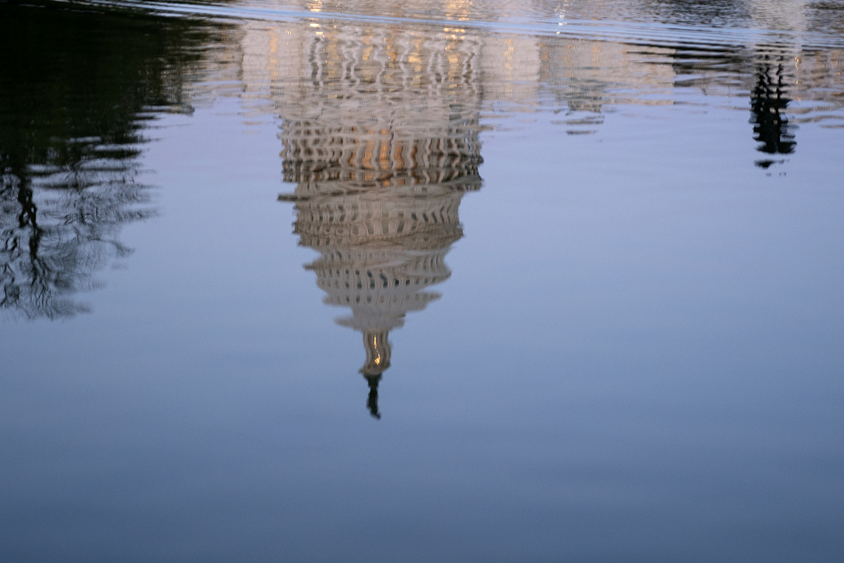 Capitol dome upside down reflected in water