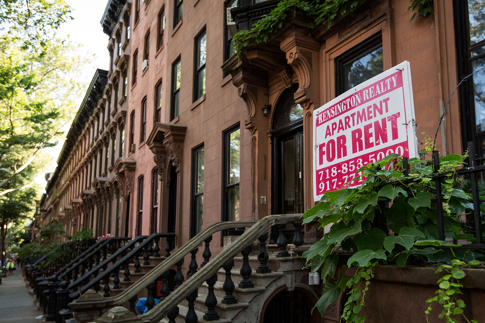 A sign advertises an apartment for rent in Brooklyn.