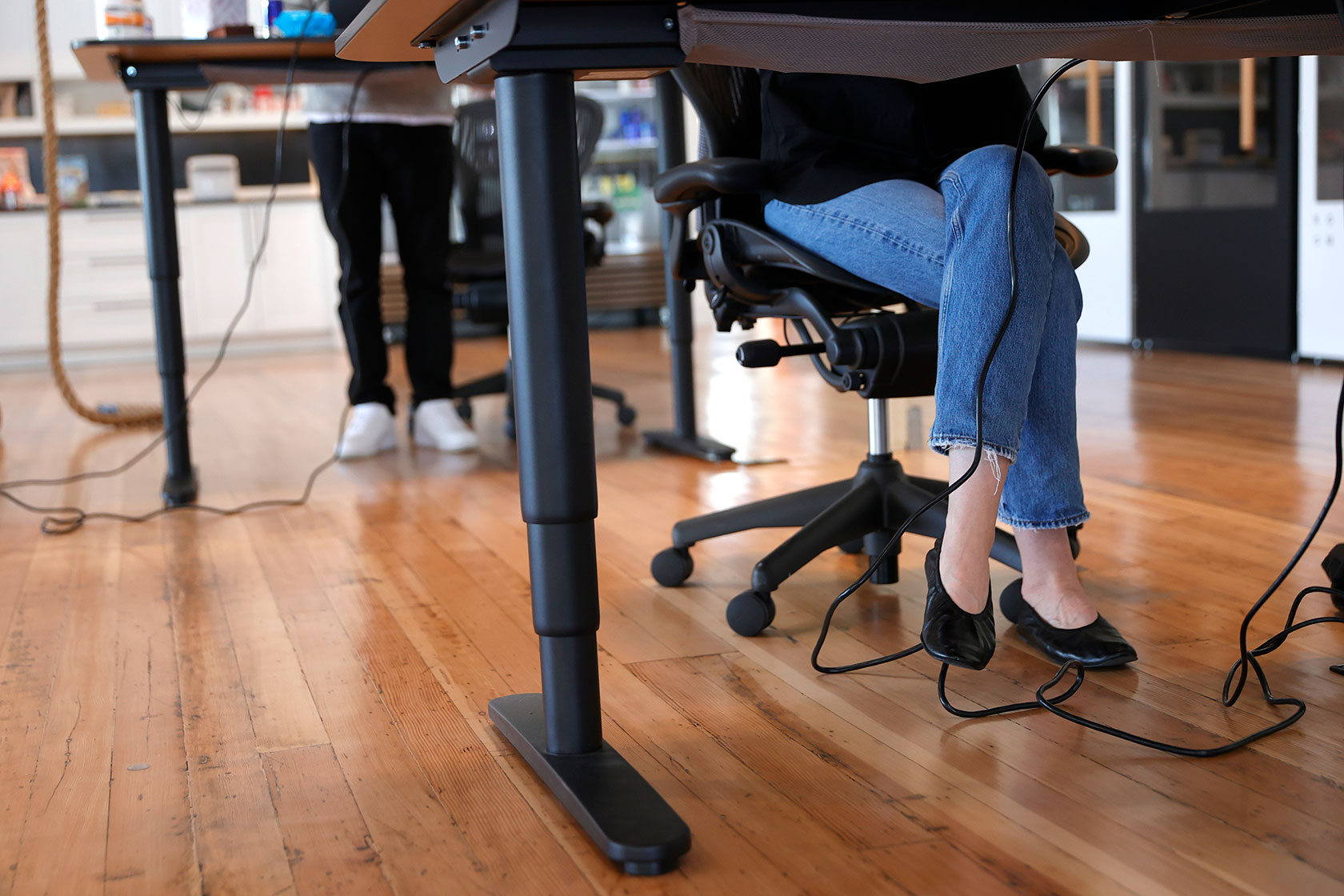 Employees work at their desks in a San Francisco office.