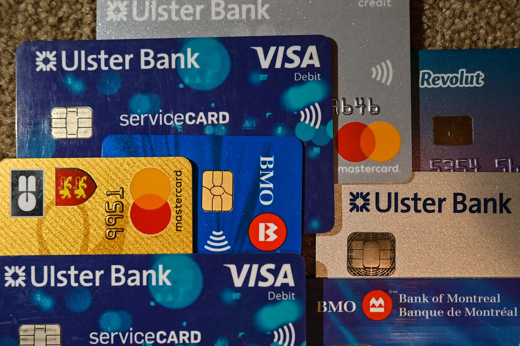 Photo shows several credit cards stacked on top of each other