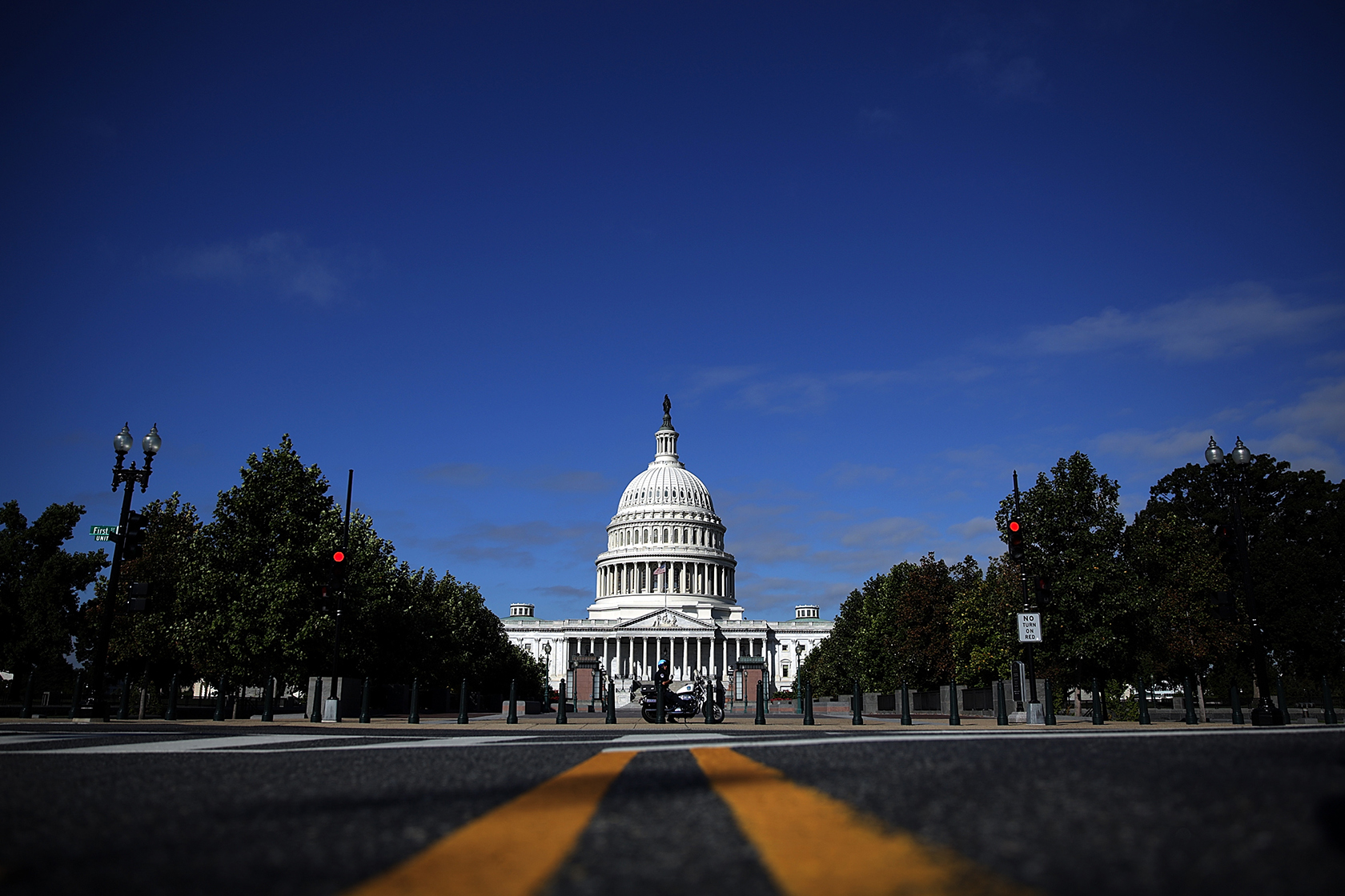 Capitol building, with yellow lines on road leading to it