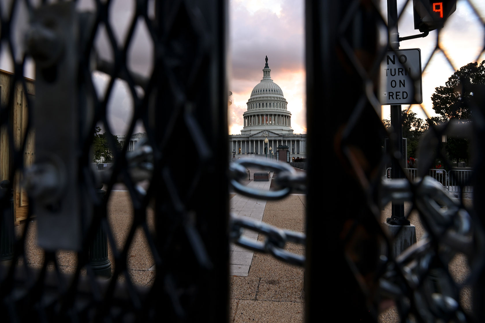 The U.S. Capitol is seen behind security fencing.