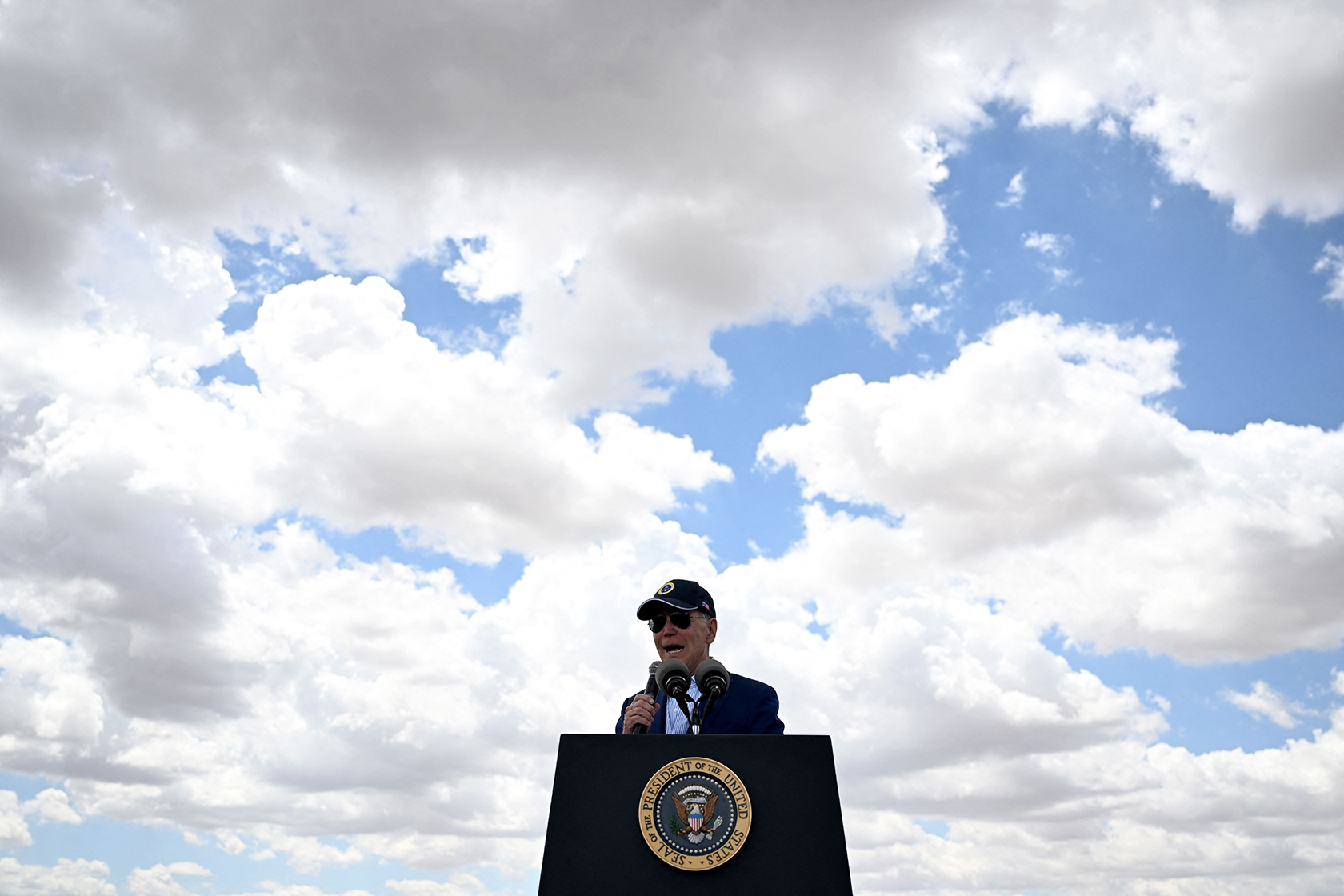 Joe Biden in front of clouds in sky