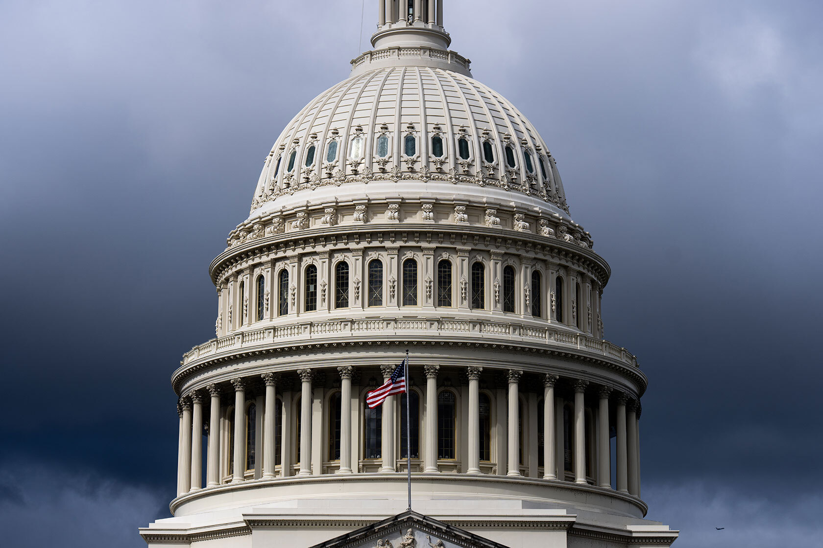 Dark clouds hang above the U.S. Capitol.